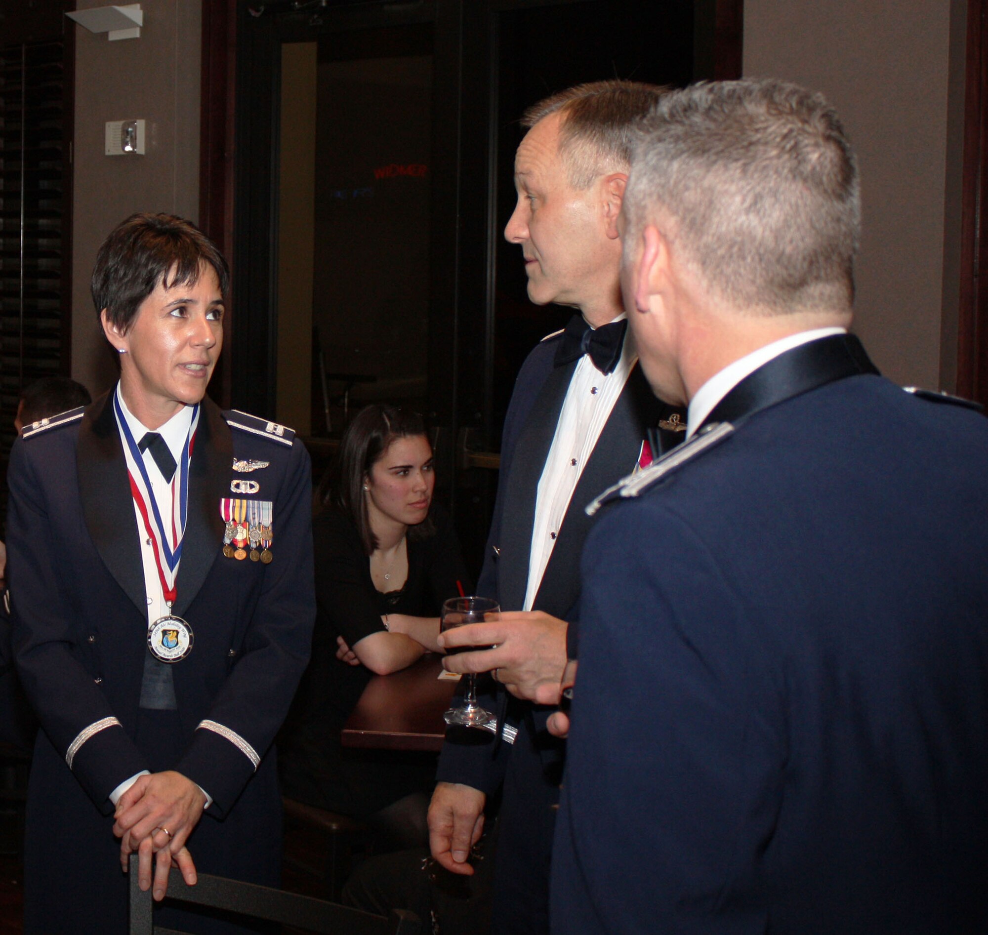 TRAVIS AIR FORCE BASE, Calif. -- Capt. Susan Labrecque, 349th Air Mobility Wing Executive Officer, speaks with Maj. Gen. (sel) Eric W. Crabtree, 4th Air Force commander, prior to the 349th AMW Annual Awards Banquet. Capt. Labrecque went on to be honored as the 349th AMW Company Grade Officer of the Year at the Delta Breeze Club, Jan 23. (U.S. Air Force photo/Master Sgt. Robert Wade) 