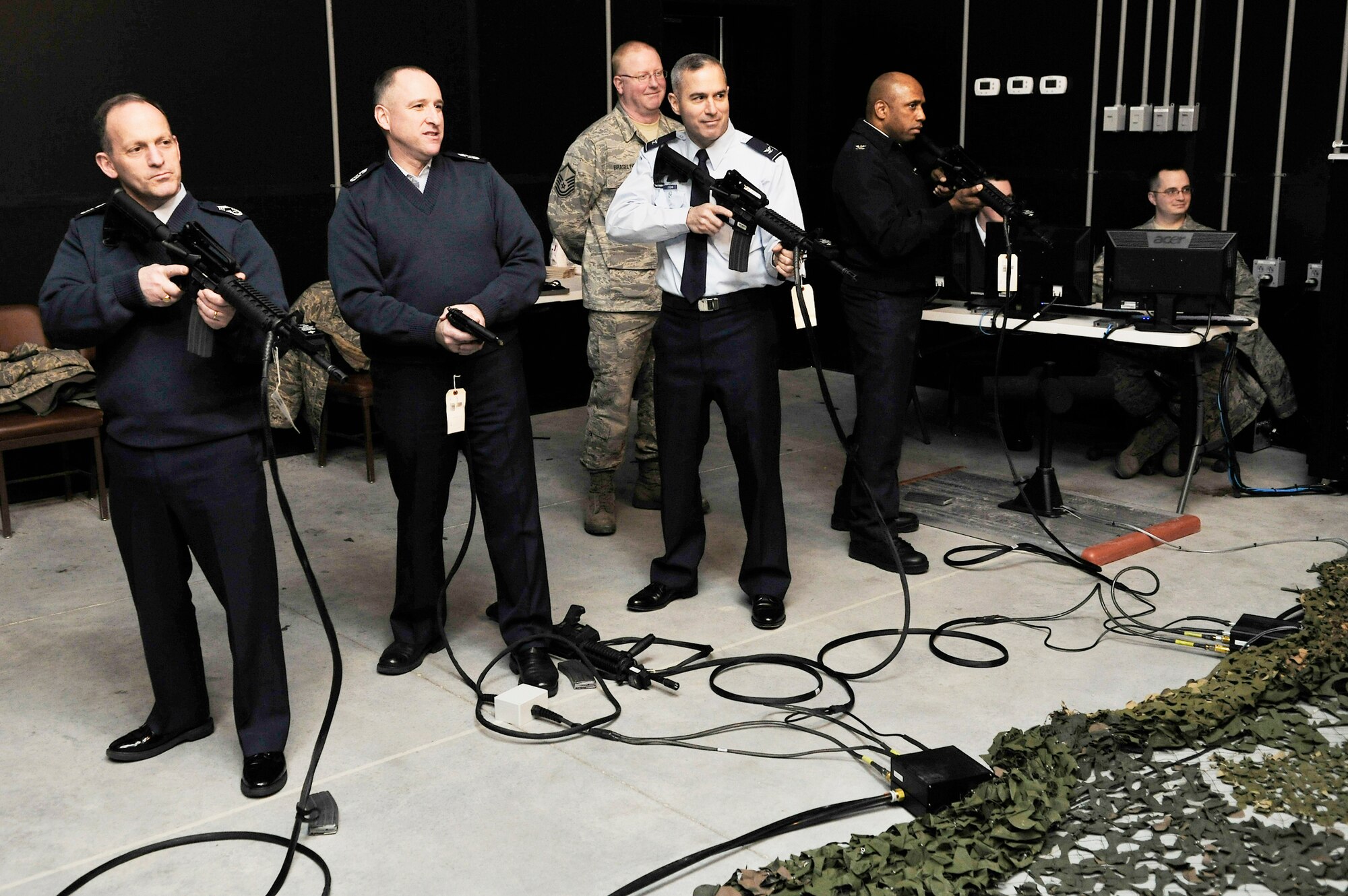 Airmen test out the Engagement Skills Trainer 2000 Jan. 4, 2010, at Eielson Air Force Base, Alaska. The EST 2000 provides Airmen several scenarios in which they would be required to fire their weapon. (U.S. Air Force photo/Staff Sgt. Christopher Boitz)
