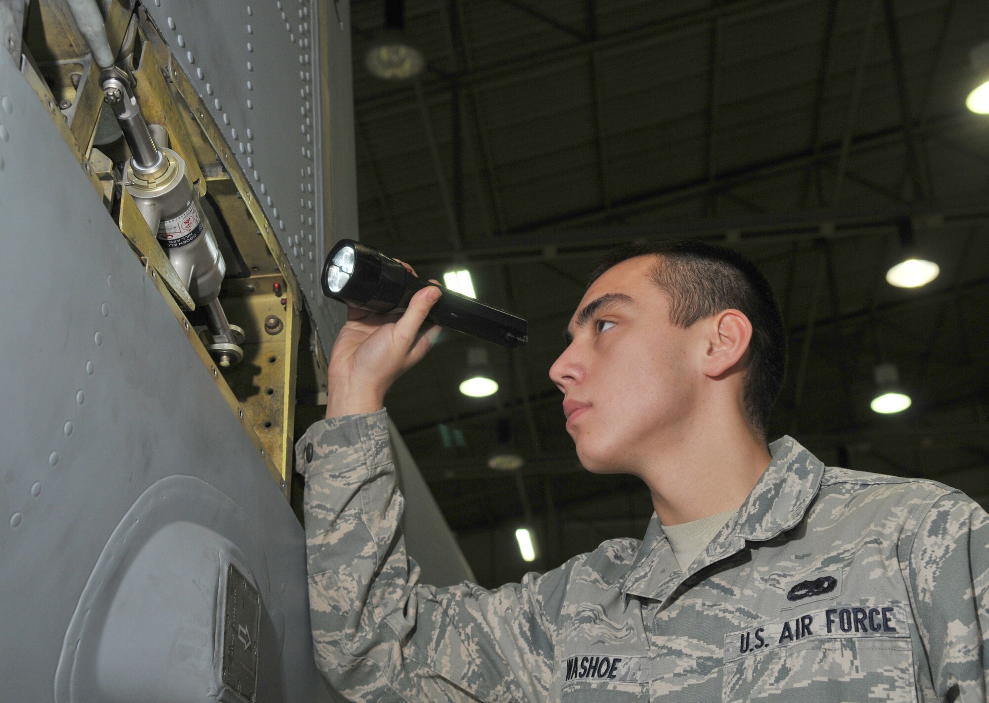 SPANGDAHLEM AIR BASE, Germany -- Airman Richie Washoe, 52nd Equipment Maintenance Squadron, inspects an A-10 Thunderbolt II's rudder actuator Jan. 21 in Hangar 2 to ensure proper operation of vital flight components. The rudder actuator is the component that drives the flight-control surface, allowing the pilot to steer the aircraft in flight. (U.S. Air Force photo/Airman 1st Class Nick Wilson)