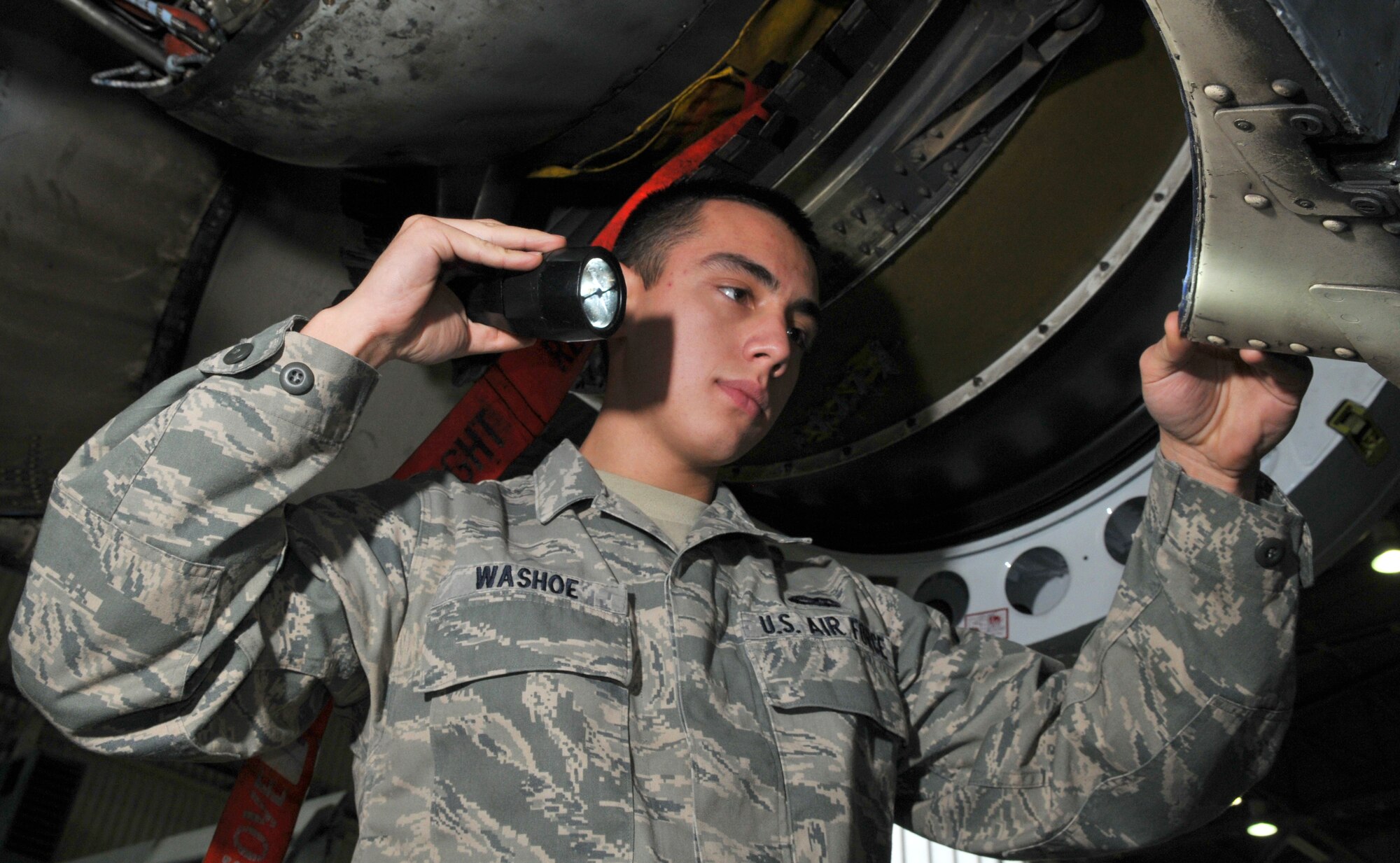 SPANGDAHLEM AIR BASE, Germany -- Airman Richie Washoe, 52nd Equipment Maintenance Squadron, inspects an A-10 Thunderbolt II's engine Jan. 21 in Hangar 2. Airman Washoe ensured the thrust mounts were not cracked or damaged to prevent airframe damage or engine loss. The engine of an A-10 is worth about $2 million, and the entire aircraft is worth nearly $12 million. (U.S. Air Force photo/Airman 1st Class Nick Wilson)