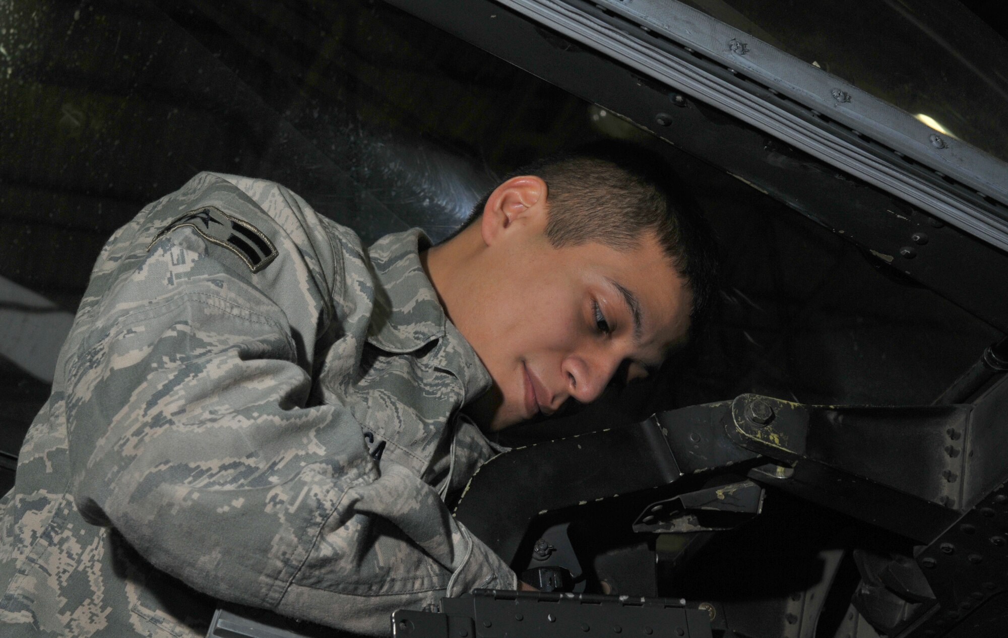 SPANGDAHLEM AIR BASE, Germany -- Airman 1st Class Randy Zuniga, 52nd Equipment Maintenance Squadron, inspects an A-10 Thunderbolt II's ejection seat Jan. 21 in Hangar 2. This was completed as part of the A-10's phase inspection checklist, which is separated into two phases. Within each phase, about 675 maintenance manuals called "work cards" are used to inspect different areas of the aircraft. (U.S. Air Force photo/Airman 1st Class Nick Wilson)