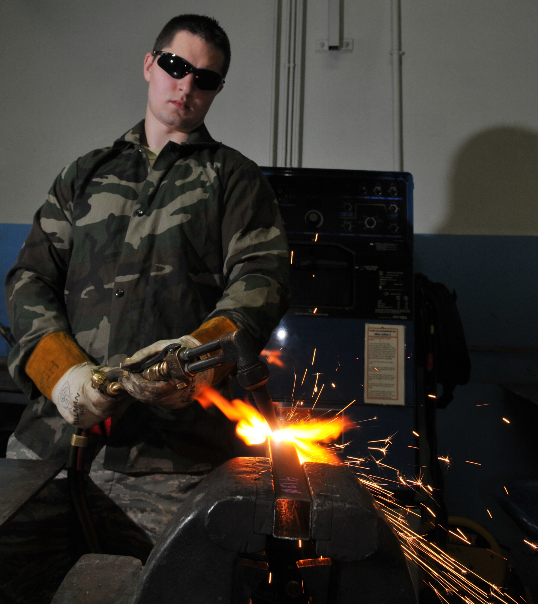 SPANGDAHLEM AIR BASE, Germany -- Senior Airman James Hurst, 52nd Equipment Maintenance Squadron, cuts metal with an oxyacetylene rig Jan. 22 in the metals technology welding room. This process is necessary to cut metal to a size small enough for disposal. (U.S. Air Force photo/Airman 1st Class Nick Wilson)