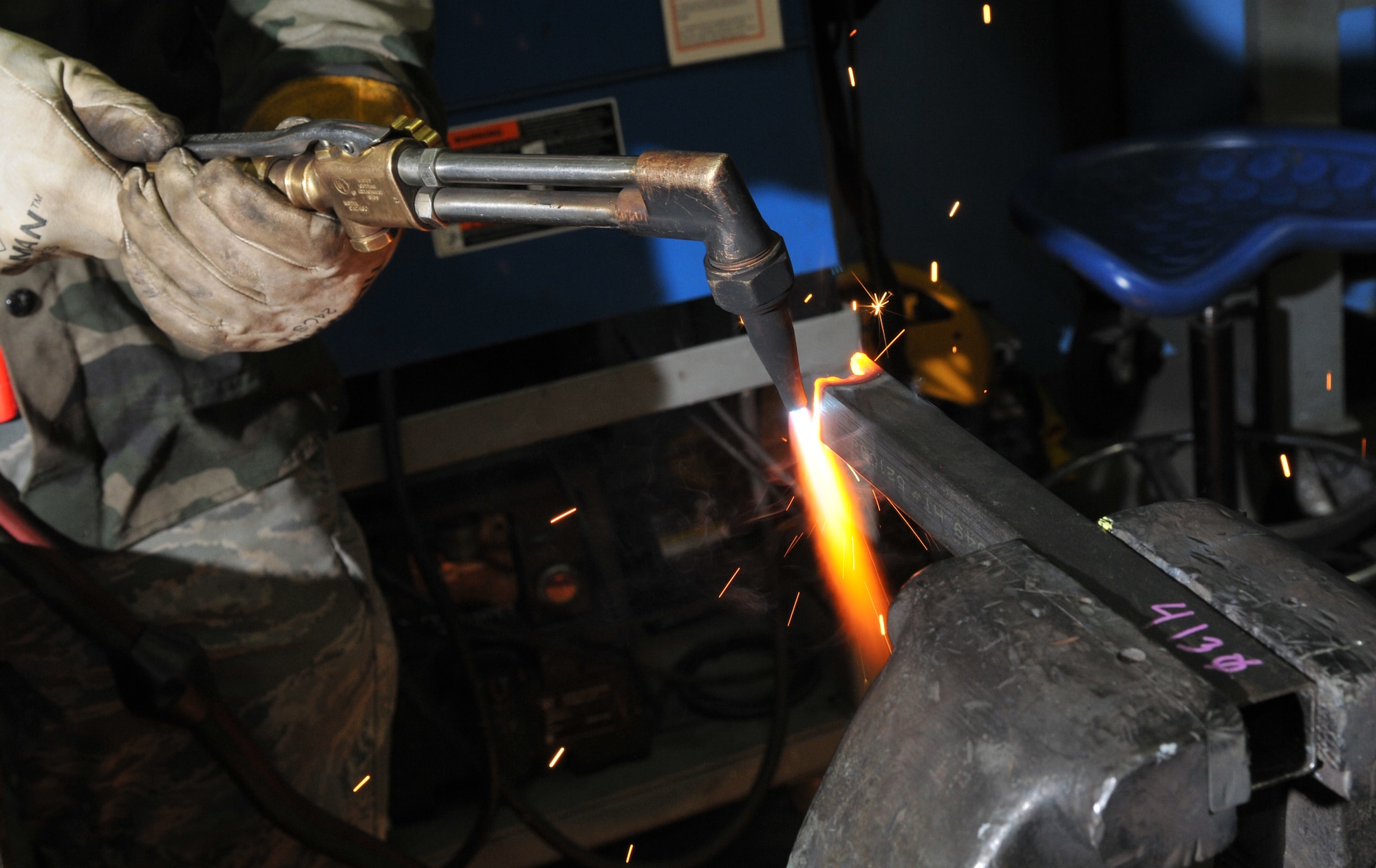 SPANGDAHLEM AIR BASE, Germany -- Senior Airman James Hurst, 52nd Equipment Maintenance Squadron, cuts metal with an oxyacetylene rig Jan. 22 in the metals technology welding room. This process is necessary to cut metal to a size small enough for disposal. (U.S. Air Force photo/Airman 1st Class Nick Wilson)