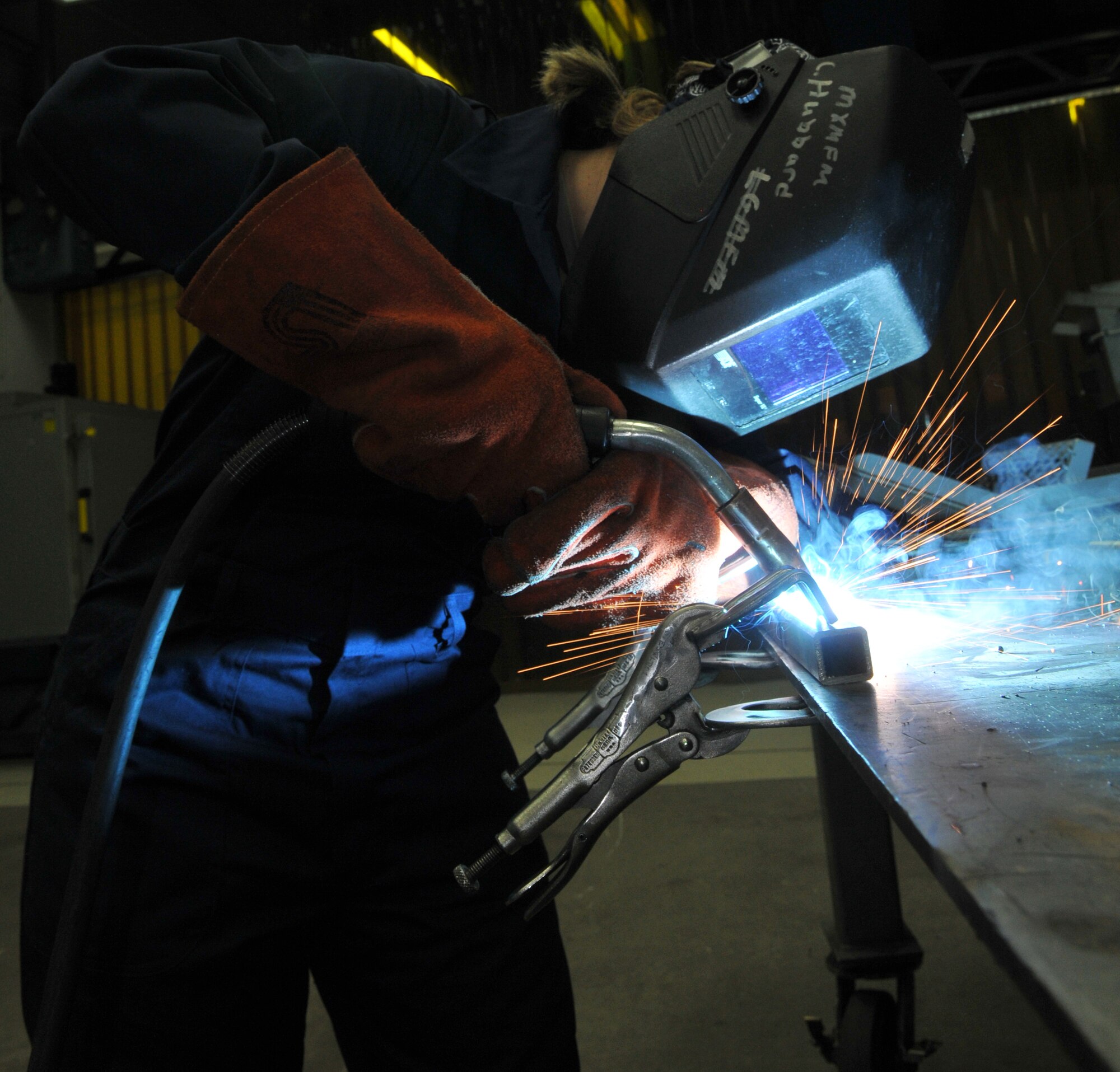 SPANGDAHLEM AIR BASE, Germany -- Airman 1st Class Abigail Dressler, 52nd Equipment Maintenance Squadron, uses metal inert gas to weld a piece of equipment Jan. 22 in the metals technology welding room. This is done to fabricate aircraft support equipment such as stands for aircraft maintenance, power units and air conditioning units. (U.S. Air Force photo/Airman 1st Class Nick Wilson)