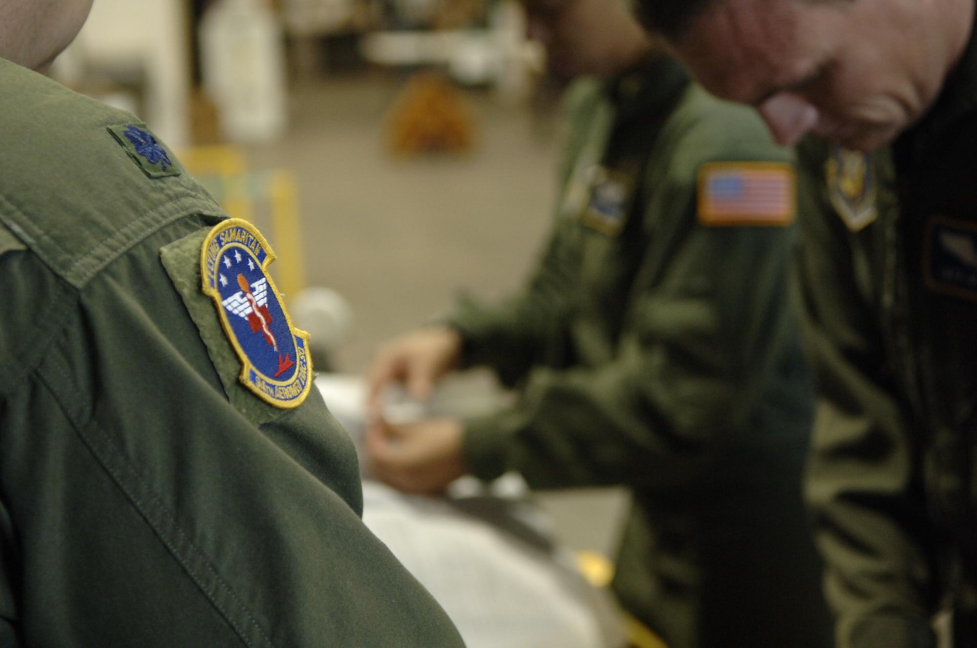 The “Flying Samaritans” of the 94th Aeromedical Evacuation Squadron inspect their equipment before departing on an AE mission to Haiti Jan. 22.  AE is one of the three core capabilities of Air Mobility Command, the others include airlift and aerial refueling. (U.S. Air Force photo by 2nd Lt. Nicholas Mercurio/Released)