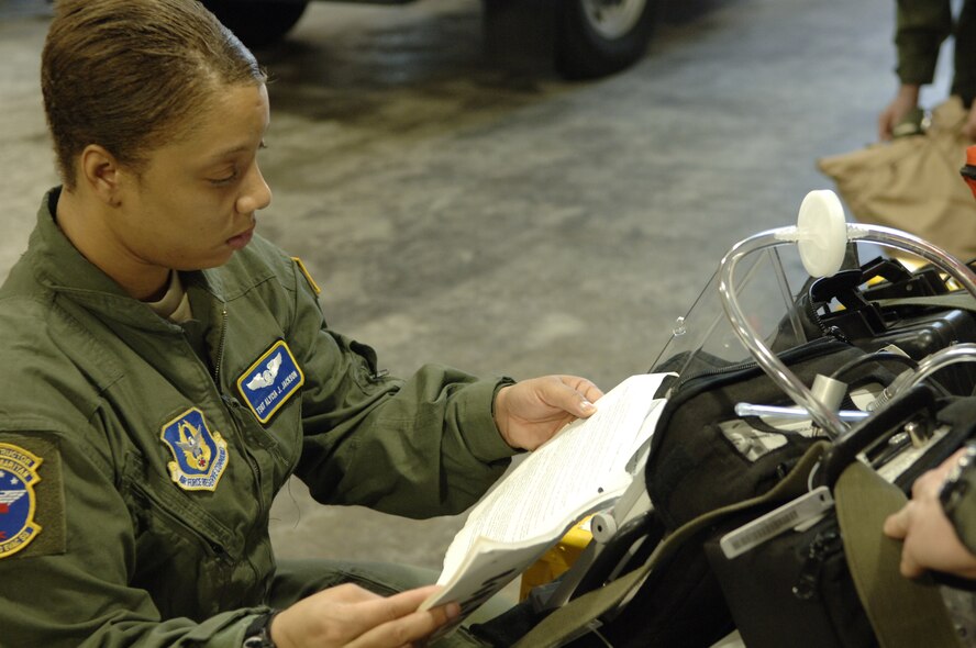 Tech. Sgt. Alycia J. Jackson, 94th Aeromedical Evacuation Squadron, inspects medical equipment before boarding a C-130 bound for Haiti Jan. 22.  The crew out of Dobbins Air Reserve Base, Ga. transported 48 Haitian nationals including 18 urgent-care patients and four critical-care patients. (U.S. Air Force photo by 2nd Lt. Nicholas Mercurio/Released)