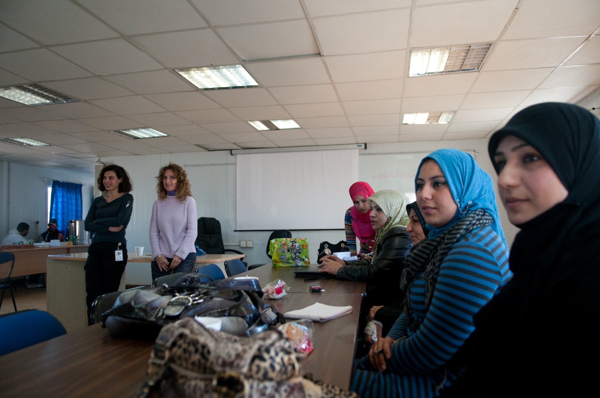 Ms. Anna Prouse (back right), Itallian Provincial Reconstruction Team camp leader, host a first Iraqi women journalist conference with Ms. Gina Di Meo (back left), an Italian reporter from New York tri-stae area to improve the reporting skills of the Iraqi journalist at the PRT camp, Mittica, Iraq Jan. 23, 2010. (U.S. Air Force photo by Elizabeth Gilbert) Released.
