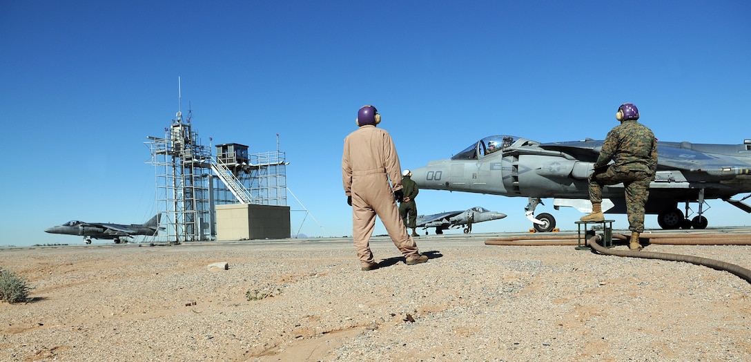 Marine Attack Squadron 311 AV-8B Harriers land and taxi at the Auxiliary Airfield 2 in Yuma, Ariz., Jan. 25, 2010. AUX-2 is a replica of the deck of an amphibious assault ship, on which squadrons practice before working off of an actual ship at sea. The squadron started training at AUX-2 Jan. 26-28, 2010, in preparation for their carrier qualification aboard the USS Peleliu in February 2010. The squadron is scheduled to deploy to the Peleliu with the 15th Marine Expeditionary Unit in May 2010. Part of the squadron deployed to Japan with the 31st MEU in early January 2010.