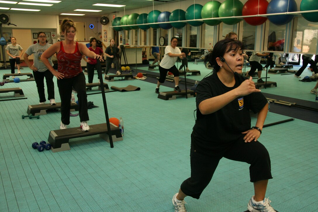 Honey L. Cushman, instructor and trainer with Cherry Point’s Semper Fit program, leads her class in strenuous work out routines during a hips, abdomen, buttocks, and inner thighs class at the Fitness Connection, Jan. 26.