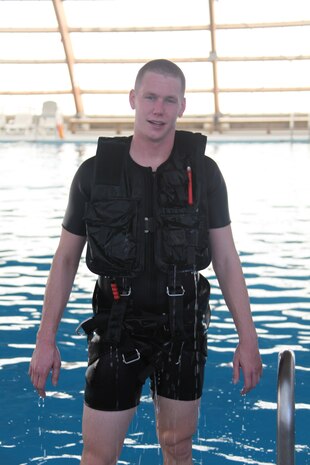Cpl. James B. Edwards, a VMR-1 search and rescue swimmer, climbs out of the pool after completing the 900-meter swim portion of his rescue swimmer requalification, Jan. 26. Rescue swimmers must qualify twice annually to maintain their proficiency.