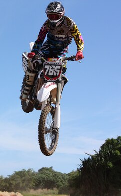 ANDERSEN AIR FORCE BASE, Guam - Senior Airman Jesse Clokey, 734th Air
Mobility Squadron, soars through the sky after a jump during the final race
of the 2009 Open-Class Motocross Championship Dec. 6. Airman Clokey took
home the championship and finished the year with 13 race wins on Guam. (Courtesy photo)