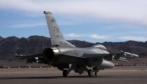 An F-16 "Mako" from Homestead Air Reserve Base, Fla. taxis onto the runway of Nellis Air Force Base, Nev., to participate in the advanced aerial combat training exercise, Red Flag, Jan. 26. This is the first time in 16 years HARB has participated in the exercise. (U.S. Air Force photo/ Tech. Sgt. Bucky Parrish)
