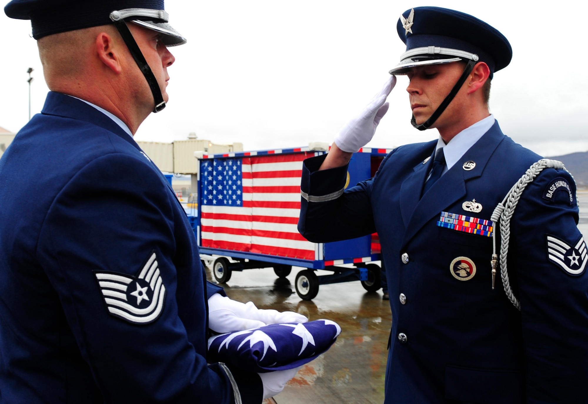 EL PASO, Texas -- Staff Sgt. Mitchell Bisson with the Holloman Air Force Base, N.M., Steel Talons Honor Guard, salutes the U.S. flag during a dignified transfer, Jan. 22. A dignified transfer is conducted to honor those who have given their lives for the service of their country. (U.S. Air Force photo by Senior Airman Tiffany Trojca)                     