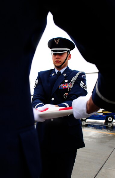 EL PASO, Texas -- Staff Sgt. Jose Santiago of the Holloman Air Force Base, N.M., Steel Talons Honor Guard helps fold the U.S. flag during a dignified transfer, Jan. 22. A dignified transfer is conducted to honor those who have given their lives for the service of our country. (U.S. Air Force photo by Senior Airman Tiffany Trojca)