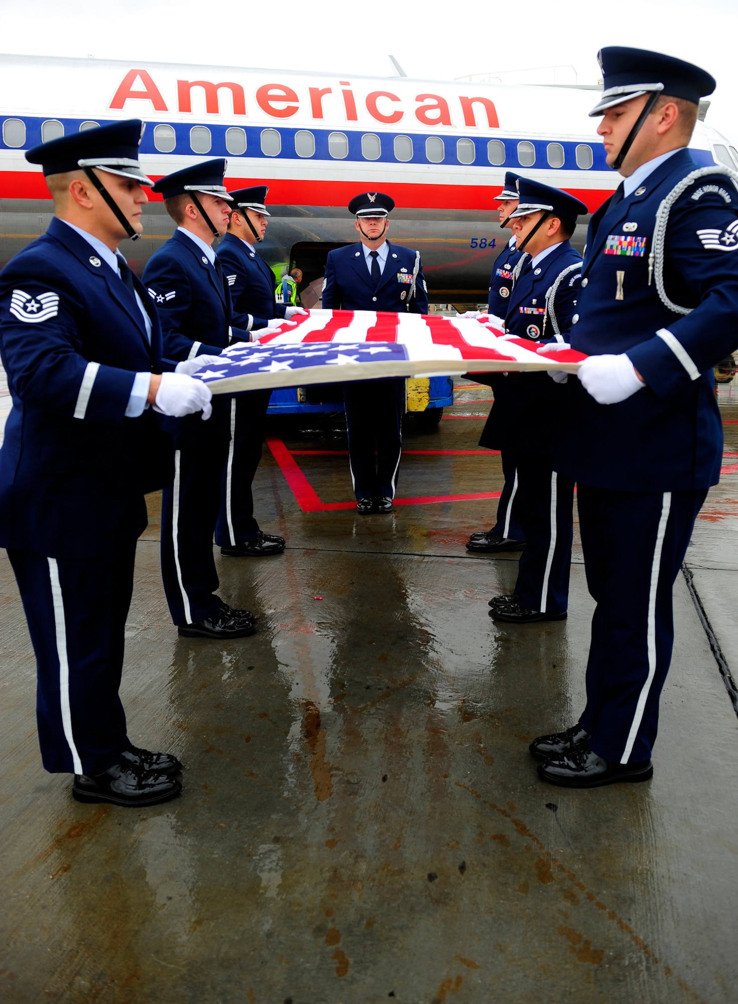 EL PASO, Texas -- Members of the Holloman Air Force Base, N.M., Steel Talons Honor Guard prepare to fold the U.S. flag during a dignified transfer, Jan. 22. A dignified transfer is conducted to honor those who have given their lives for the service of their country. (U.S. Air Force photo by Senior Airman Tiffany Trojca)