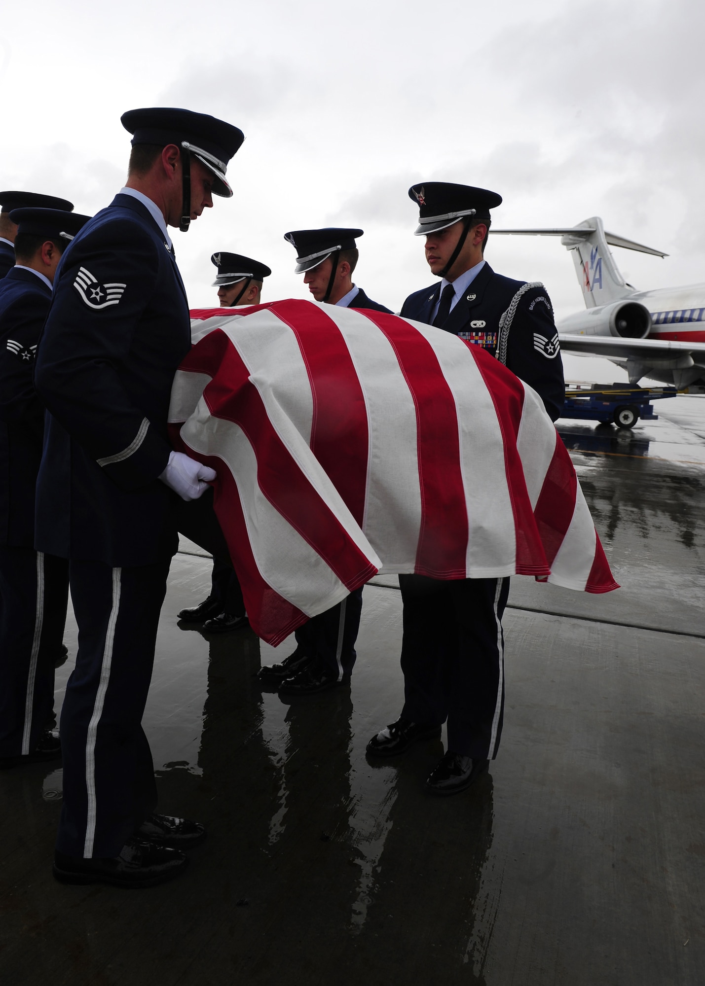 EL PASO, Texas -- Members of the Holloman Air Force Base, N.M., Steel Talons Honor Guard transport the remains of Senior Airman Sean McGinnis during a dignified transfer, Jan. 22. Airman McGinnis was assigned to the 49th Maintenance Squadron and stored munitions to support multiple agencies to include the F-22 Raptor, 46th Test Group, White Sands Missile Range and German air force. (U.S. Air Force photo by Senior Airman Tiffany Trojca)