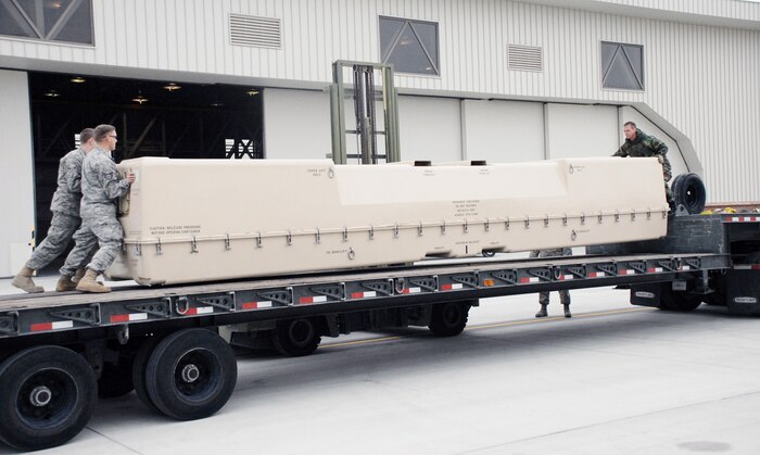 Airmen with the 432nd Aircraft Maintenance Squadron at Creech Air Force Base, Nev., prepare an RQ-1 Predator for deployment in support of Operation Unified Response, Jan. 20.  The Predator is a medium-altitude, long-endurance, remotely piloted aircraft. (U.S. Air Force photo/Staff Sgt. Alice Moore)