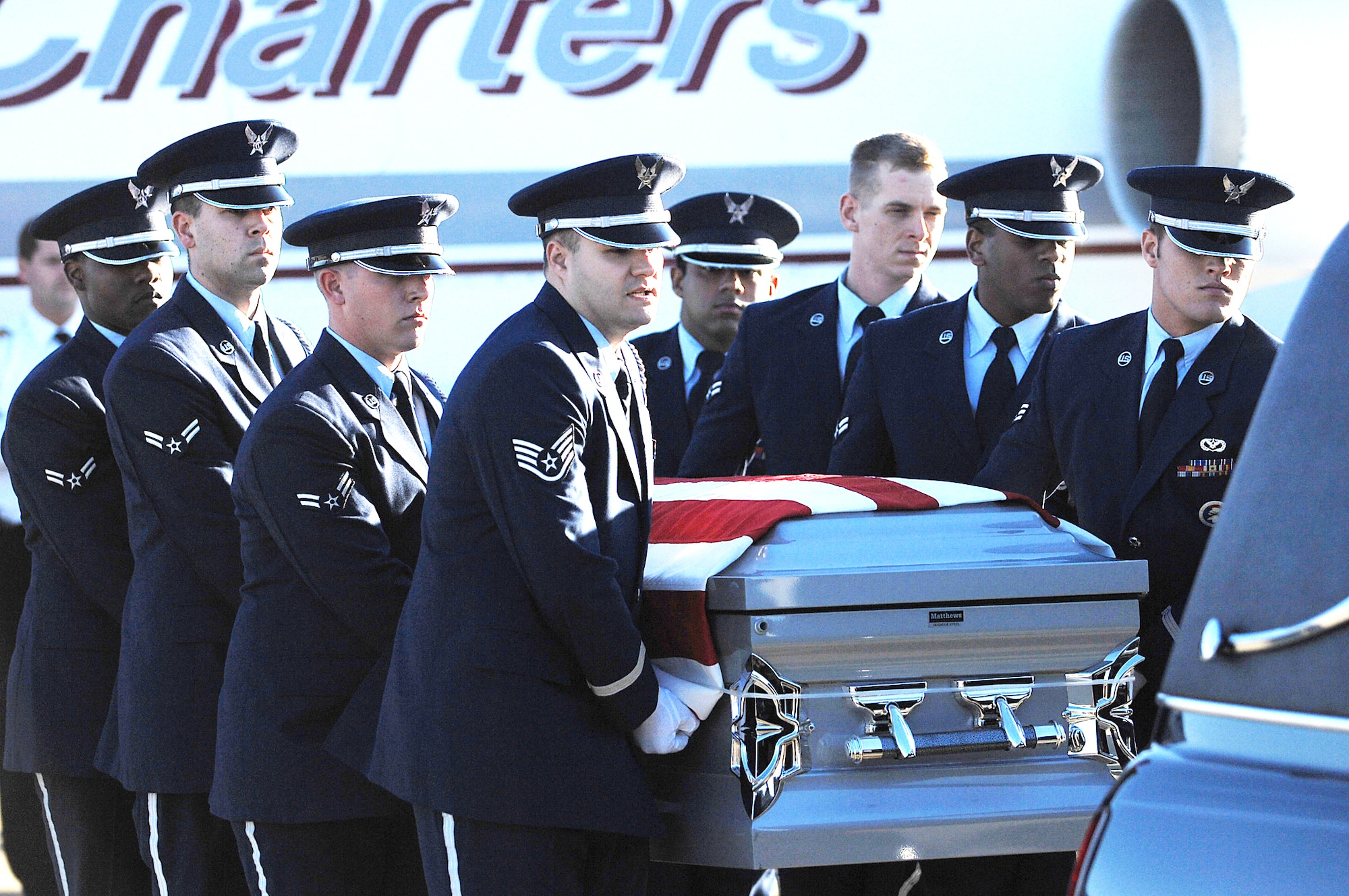 Base honor guard members perform the dignified transfer of Tech. Sgt. Adam Ginett Jan.25, 2010 AT Seymour Johnson Air Force Base, N.C. Sergeant Ginett, a fallen explosive ordnance disposal technician, wasassigned to the 31st Civil Engineer Squadron at Aviano Air Base, Italy. (U.S. Air Force photo/Senior Airman Ciara Wymbs)