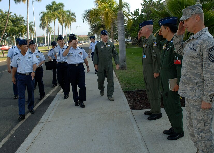 General Kenichiro Hokazone, Japan Air Self-Defense Force chief of staff, Gen. Gary North, Pacific Air Forces commander, and Lt. Gen. Hawk Carlisle, 13th Air Force commander, are greeted by members of the 613th Air and Space Operations Center Jan. 25, 2010 at Hickam Air Force Base, Hawaii. General Hokazono and his delegation visited Hickam Jan. 23-25. The visit coincided with the commemoration of the 50th anniversary of the signing of the U.S.-Japan Treaty of Mutual Cooperation and Security. The long-standing and strong relationship between the two partners continues to be key to regional stability in the Pacific. (U.S. Air Force photo/Tech. Sgt. Jerome S. Tayborn)