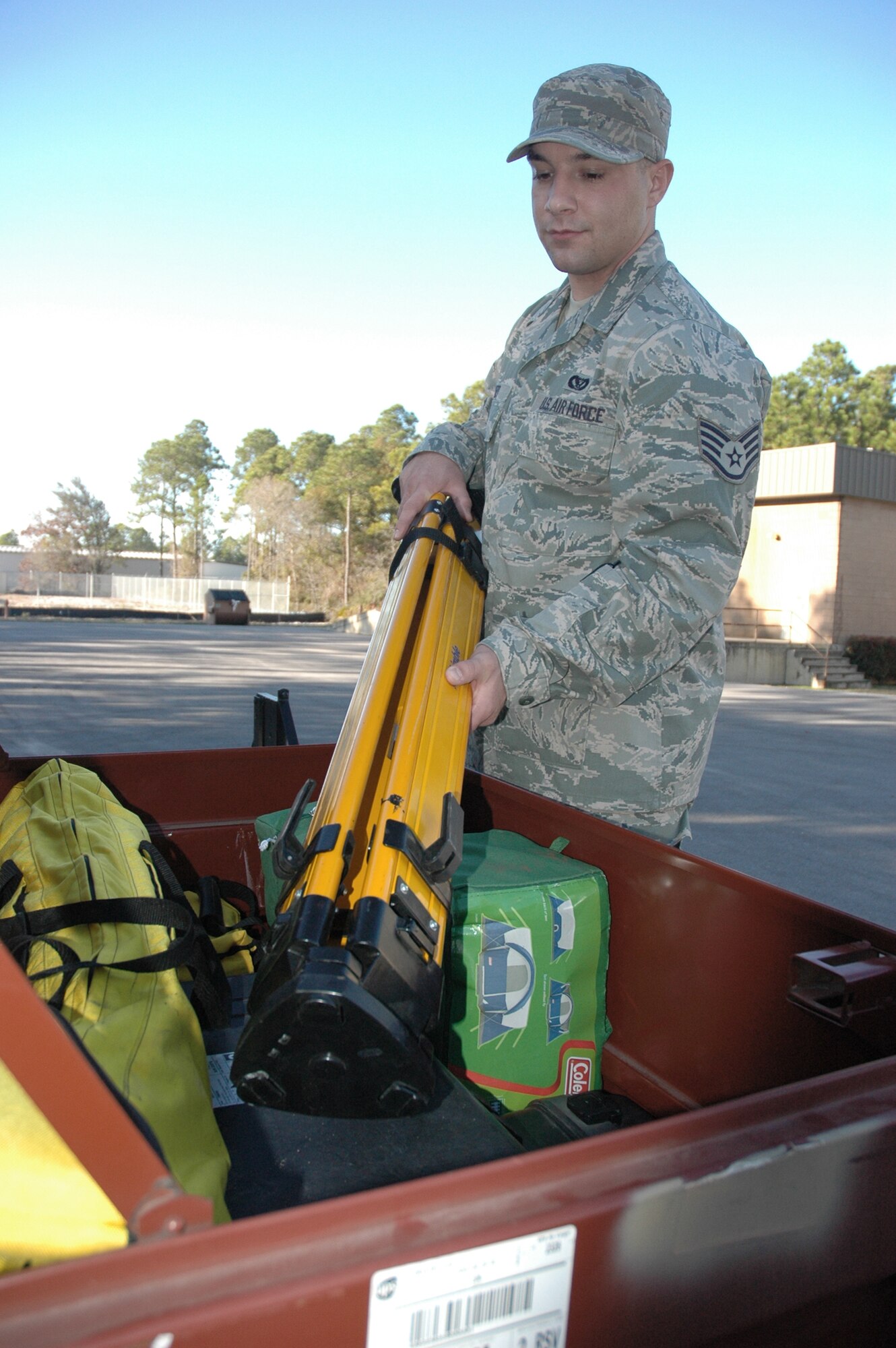 Staff Sgt. Thomas Wyatt, an airfield pavement evaluation technician at Tyndall Air Force Base, Fla., loads GPS equipment Jan. 25, 2010, that will be used to evaluate airfields throughout Haiti. (U.S. Air Force photo/Jennifer Elmore)
