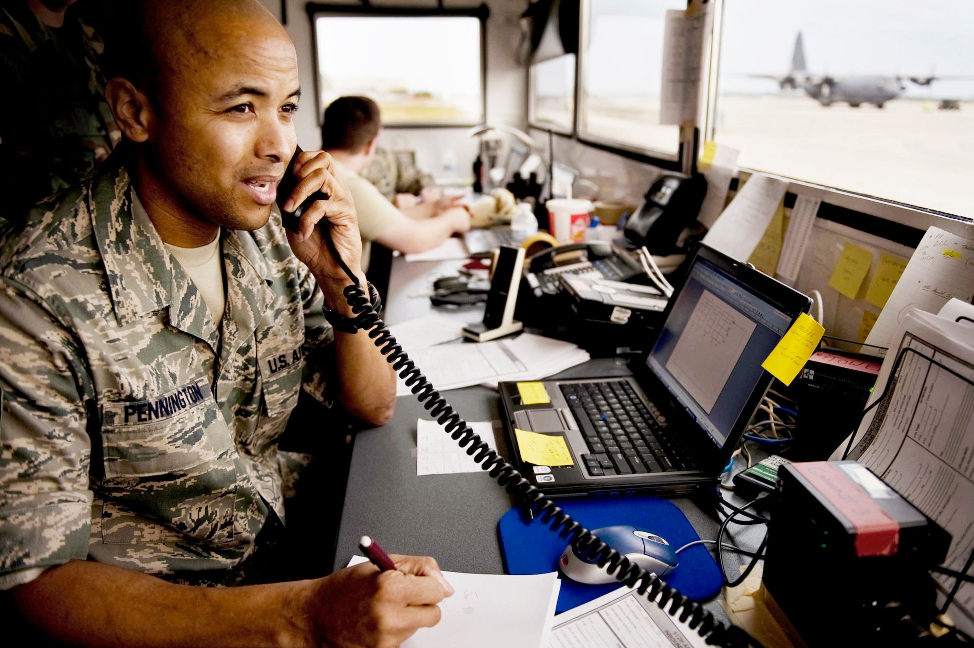 Members of the 512th Airlift Control Flight help control airflow at Homestead Air Reserve Base, Fla., as an influx of aircraft operate out of Homestead ARB to assist with the Haiti earthquake relief efforts Jan 24, 2010. (U.S. Air Force photo/Tech. Sgt. Adrian Cadiz)