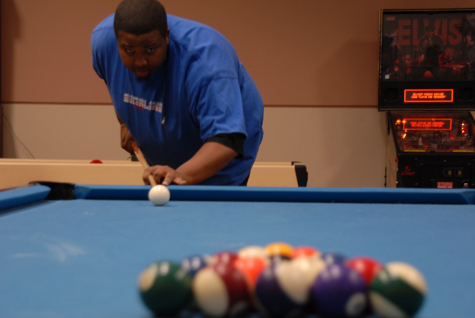 GOODFELLOW AIR FORCE BASE, Texas -- Zach Thorpe, 17th Force Support Squadron, lines to break during a base billiards tournament, Jan. 22, 2010. Approximately a dozen base personnel participated in the tournament. (U.S. Air Force photo/Staff Sgt. Laura R. McFarlane)
