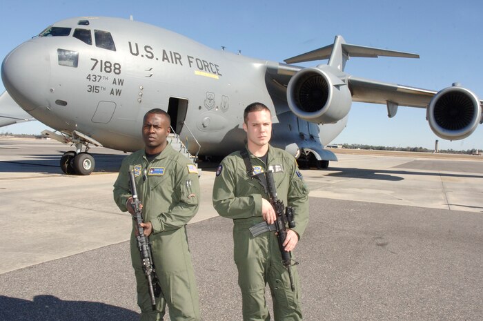 Staff Sgts. Antwan Sibley, left, and Joseph Burton, right, are Phoenix Ravens with the 628th Security Forces Squadron at Charleston AFB, S.C.  During the first 11 days of Operation Unified Response, Charleston Ravens flew 76 out of the more than 250 AMC missions into Haiti. For the entire calendar year of 2009, Charleston Ravens flew 65 missions supporting high priority missions for both the Department of Defense and Department of State. (U.S. Air Force photo/Staff Sgt. Marie Brown)