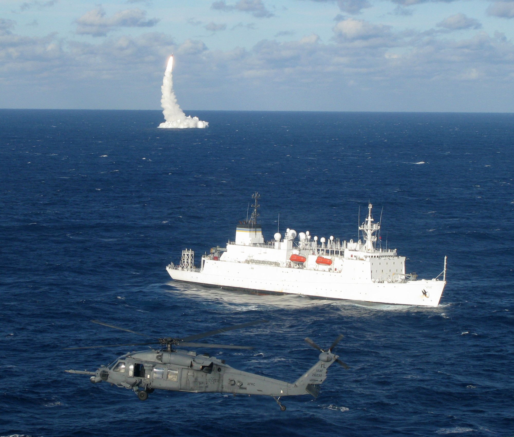 PATRICK AIR FORCE BASE, Fla. -  Two HH-60G Pave Hawk Helicopters patrol the safety zone during a rocket launch in December. (U.S. Air Force Photo/Lt. Col. Haston)