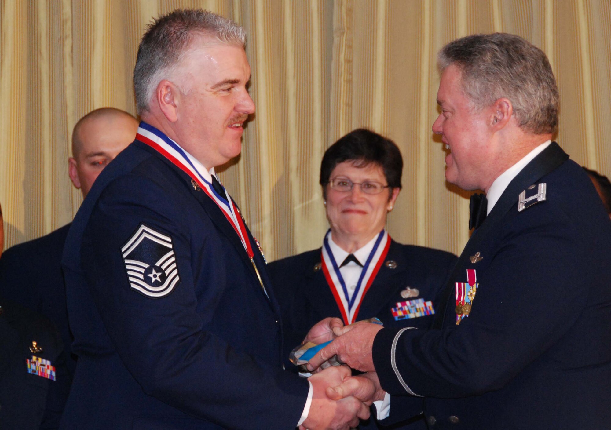 JOINT BASE MCGUIRE-DIX-LAKEHURST, N.J. - Senior Master Sgt. Wayne D. Hanna, middle, a KC-10 Extender flight engineer with the Reserve wing here, is named Senior Noncommissioned Officer of the Year 2009. Winners of the annual awards were recognized by 514th Air Mobility Wing commander, Col. James L. Kerr, right and Command Chief Master Sgt. Michael Ferraro, left, during a banquet held Jan. 23 at the Community Center. (U.S. Air Force Photo/Master Sgt. Donna T. Jeffries)