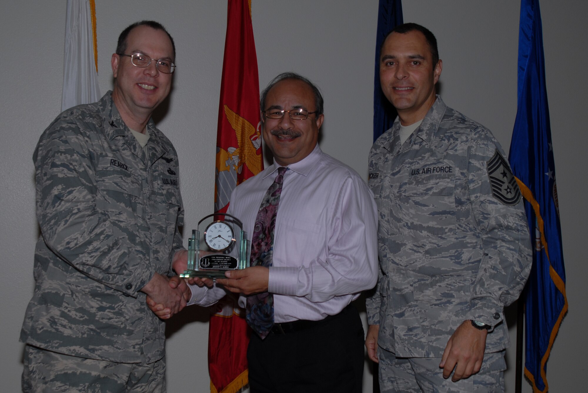 GOODFELLOW AIR FORCE BASE, Texas -- Johnny Garza, 17th Training Support Squadron, receives 17th Training Wing Civilian of the Quarter Supervisor Category 2 during the wing quarterly award ceremony, Jan. 26, 2010. (U.S. Air Force photo/Staff Sgt. Laura R. McFarlane)
