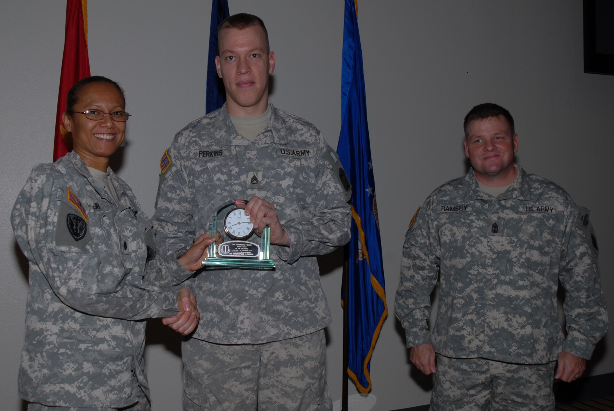 GOODFELLOW AIR FORCE BASE, Texas -- Army Staff Sgt. Christopher Perkins, 344th Military Intelligence Battalion, receives 17th Training Wing Army NCO of the Quarter during the wing quarterly award ceremony, Jan. 26, 2010. (U.S. Air Force photo/Staff Sgt. Laura R. McFarlane)
