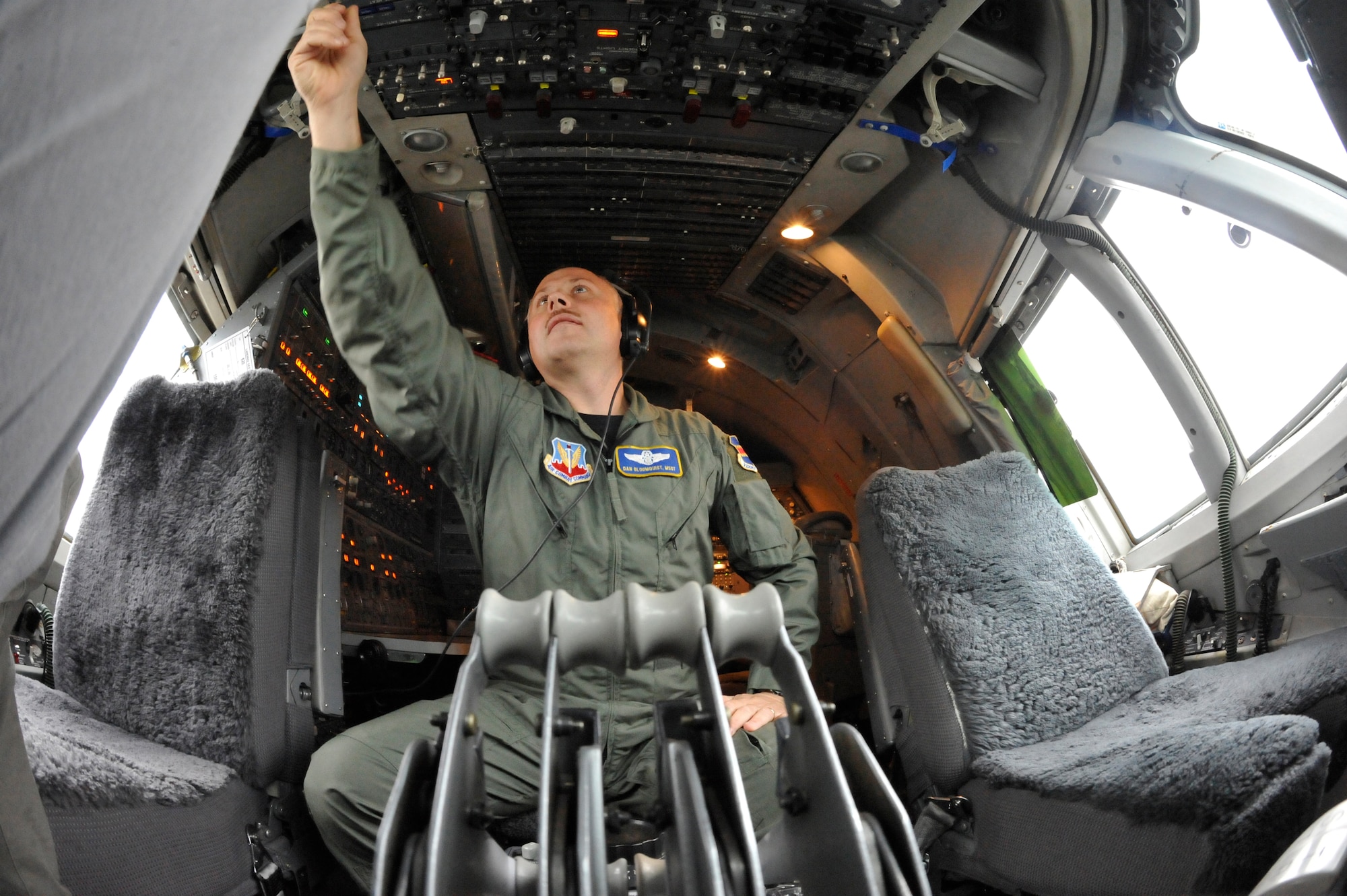 Master Sgt. Dan Bloomquist, a flight engineer with the 1st Airborne Command and Control Squadron at Offutt Air Force Base, Neb., preps an E-4B for flight during a simulated alert mission. The E-4B serves as the National Airborne Operations Center for the president, secretary of defense and chairman of the Joint Chiefs of Staff. The aircraft passed a significant milestone this month by sitting alert constantly for more than 35 years. (U.S. Air Force photo/Lance Cheung)