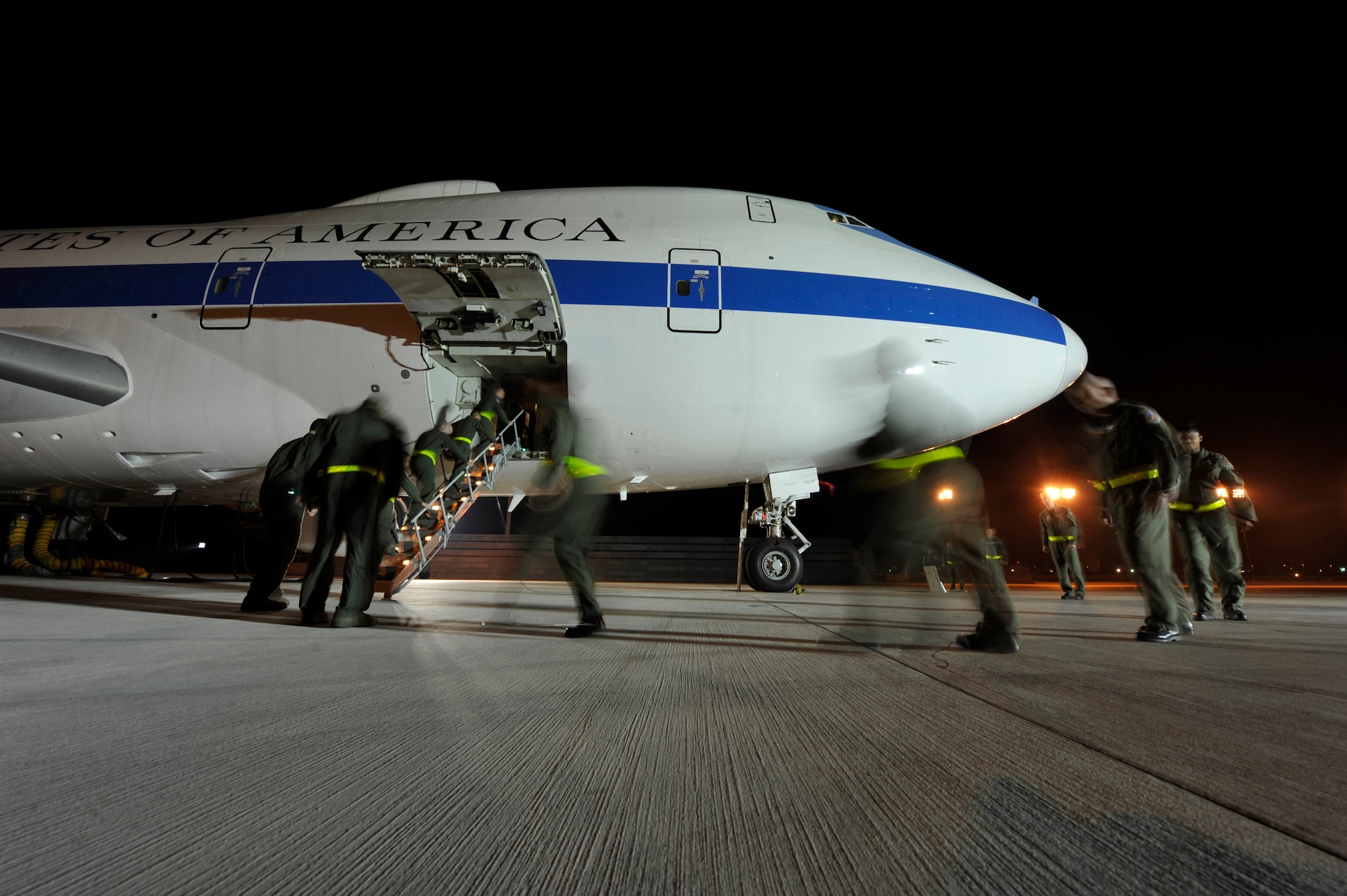 An aircrew from the 1st Airborne Command and Control Squadron board an E-4B at Offutt Air Force Base, Neb., during a simulated alert mission. The E-4B serves as the National Airborne Operations Center for the president, secretary of defense and chairman of the Joint Chiefs of Staff. The aircraft passed a significant milestone this month by sitting alert constantly for more than 35 years. (U.S. Air Force photo/Lance Cheung)