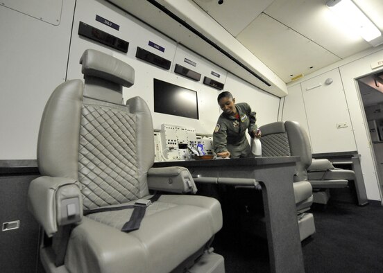 OFFUTT AIR FORCE BASE, Neb. - Staff Sgt. Krystal Lerohl, a flight attendant with the 1st Airborne Command and Control Squadron, wipes off a table in the private quarters of an E-4B prior to a simulated alert mission. The E-4B is a militarized version of the Boeing 747-200 and serves as the National Airborne Operations Center for the president, secretary of defense and chairman of the Joint Chiefs of Staff. It was delivered to the Air Force for operational use in December 1974 and assumed alert status from the EC-135J 35 years ago this month. (U.S. Air Force photo/Lance Cheung)