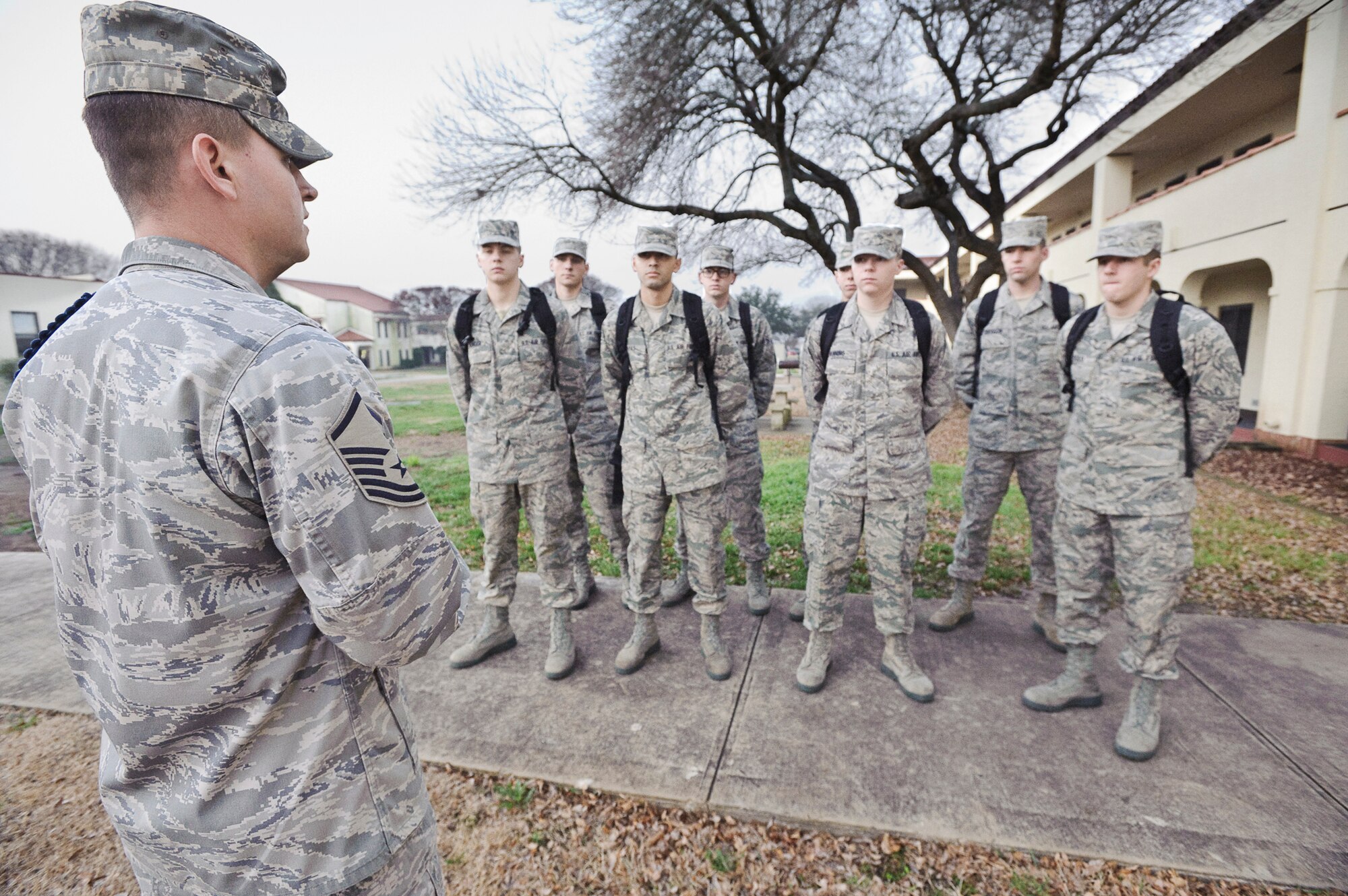 Master Sgt. Sammy Garvin reviews administrative issues during morning formation with the first eight nonprior service students assigned to the Basic Sensor Operators Course taught Jan. 20, 2010, at Randolph, Air Force Base, Texas. Sergeant Garvin is a 12th Operations Group, Det. 1 military training leader. (U.S. Air Force photo/Steve Thurow)
