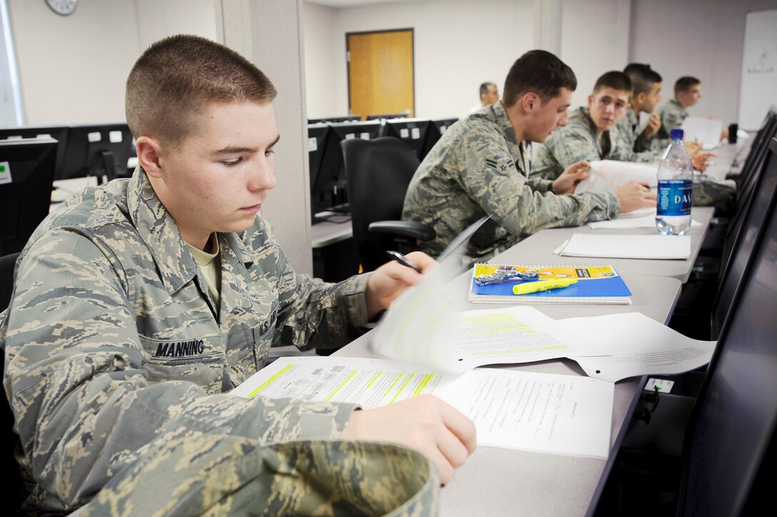 Airman Basic Corey Manning reviews his student workbook during phase one of the remotely piloted aircraft sensor operator training taught by 12th Operations Group, Det. 1, instructors Jan. 19, 2010, at Randolph Air Force Base, Texas. Airman Manning is a Basic Sensor Operator Course student. (U.S. Air Force photo/Steve Thurow) 