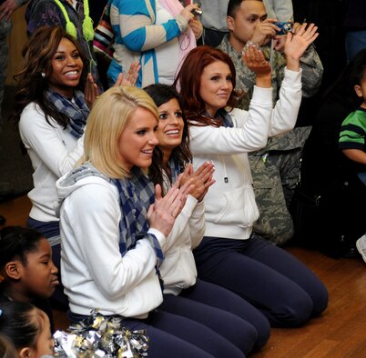 RAF MILDENHALL, England – Dallas Cowboys Cheerleaders applaud after the Lakenheath High School varsity cheerleading squad performed a routine at the Bob Hope Community Center Jan. 25. The Cowboys cheerleaders met several local cheerleading squads from Liberty Cheer and Lakenheath High School while also giving the young ladies an opportunity for photos and autographs. Country singer Neal McCoy and four members with the Dallas Cowboys Cheerleaders met with Mildenhall servicemembers and their families during the United Services Organization European Tour January 2010. (U.S. Air Force photo/ Staff Sgt. Jerry Fleshman)