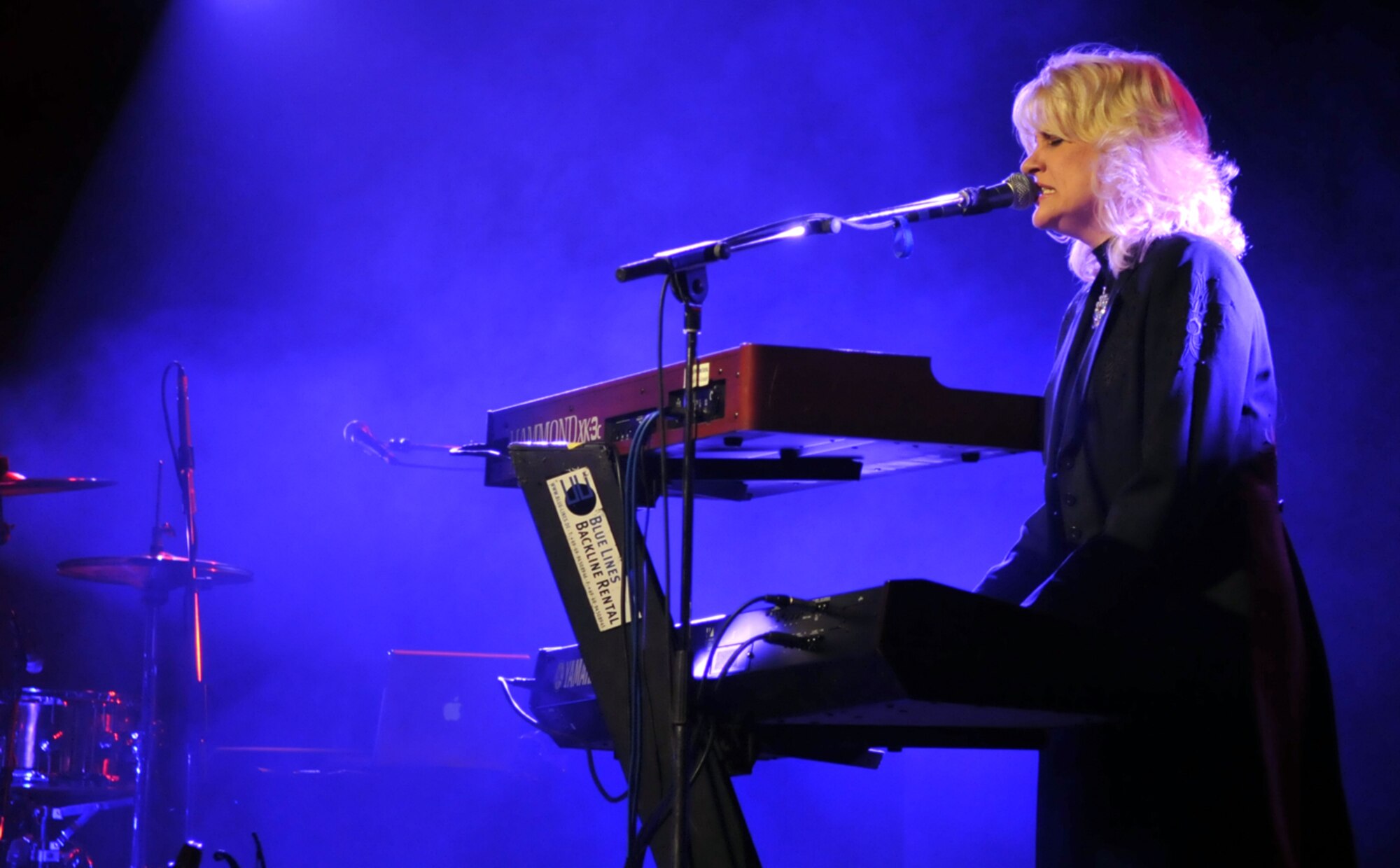 RAF MILDENHALL, England – Keyboardist Becky Priest performs a solo during a concert featuring country singer Neal McCoy and the Dallas Cowboys Cheerleaders here Jan. 25.  (U.S. Air Force photo by Staff Sgt. Austin M. May)