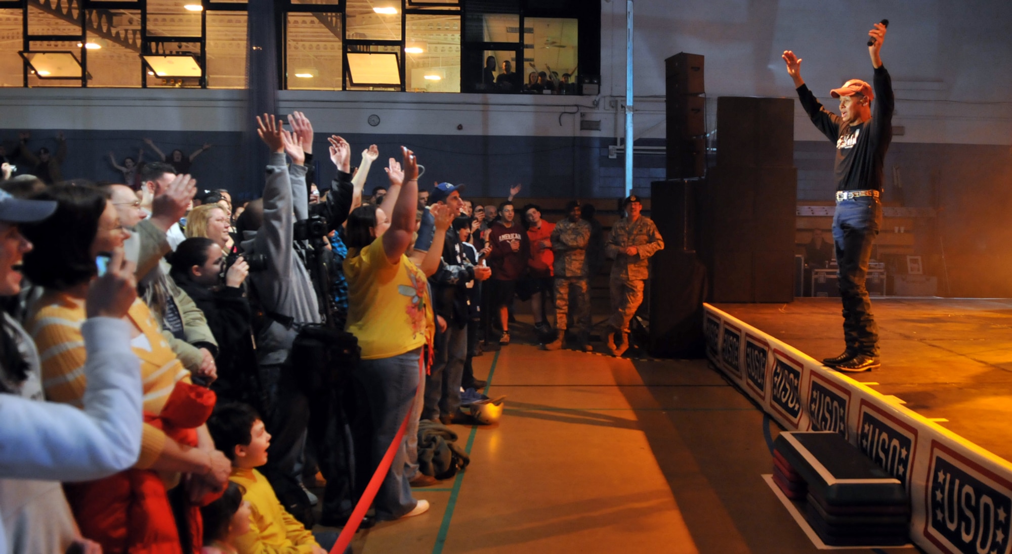 RAF MILDENHALL, England – Country singer Neal McCoy entertains the crowd at a concert at the Northside Fitness Center here Jan. 25.  The concert was part of the United Services Organization’s 2010 European tour.  (U.S. Air Force photo by Staff Sgt. Austin M. May)