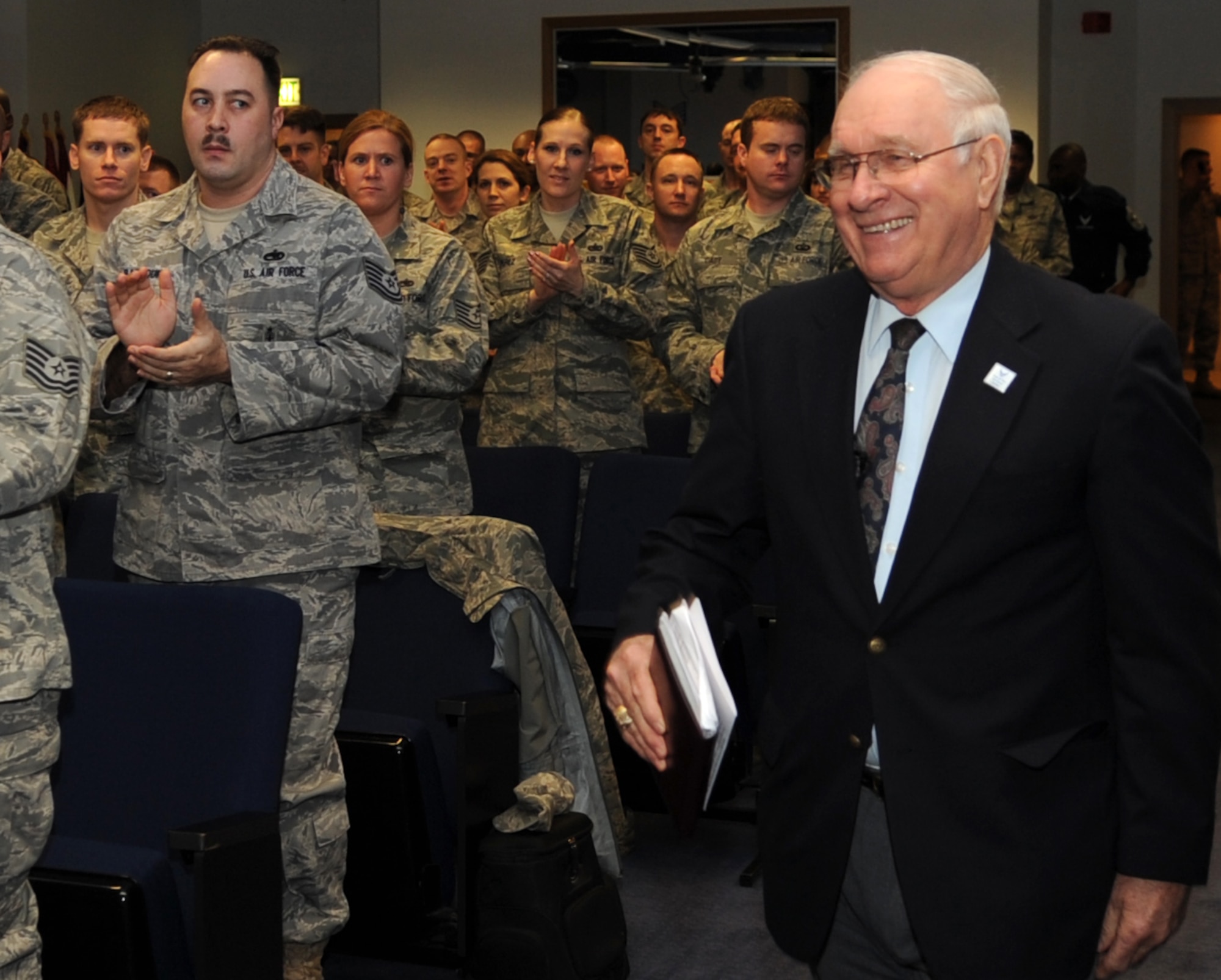 Retired eighth Chief Master Sgt. of the Air Force Sam E. Parish walks to the front of the Kisling Noncommissioned Officer Academy to speak to the current academy class, Jan. 21, 2010, Kapaun Air Station, Germany. Although the primary purpose of his visit was to meet with new chiefs and chief selects, Chief Parish also took time to meet with noncommissioned officers and Airmen new to the Air Force. (U.S. Air Force photo by Airman 1st Class Caleb Pierce)