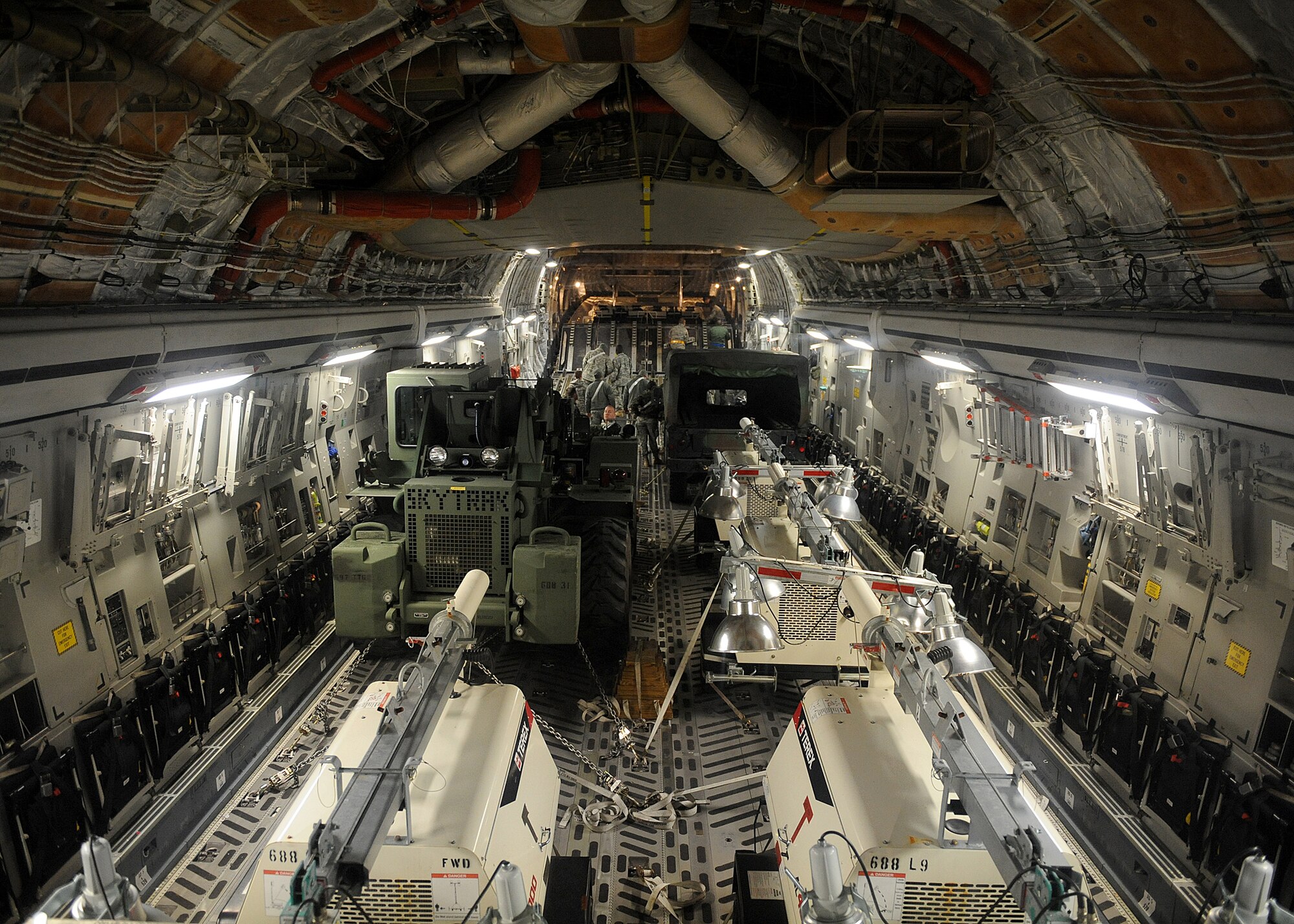 LANGLEY AIR FORCE BASE, Va. – Vehicles, equipment, and supplies are shown loaded into the bay of a C-17 Globemaster III Jan. 22 in support Operation Unified Response, a massive movement of military personnel and supplies to aid in relief efforts following the devastating earthquake that struck Haiti on Jan. 12. Langley Airmen and U.S. Army personnel from Fort Eustis loaded the aircraft, the third of its type to transfer Peninsula efforts. (U.S. Air Force photo/ Airman Rebecca Montez)
