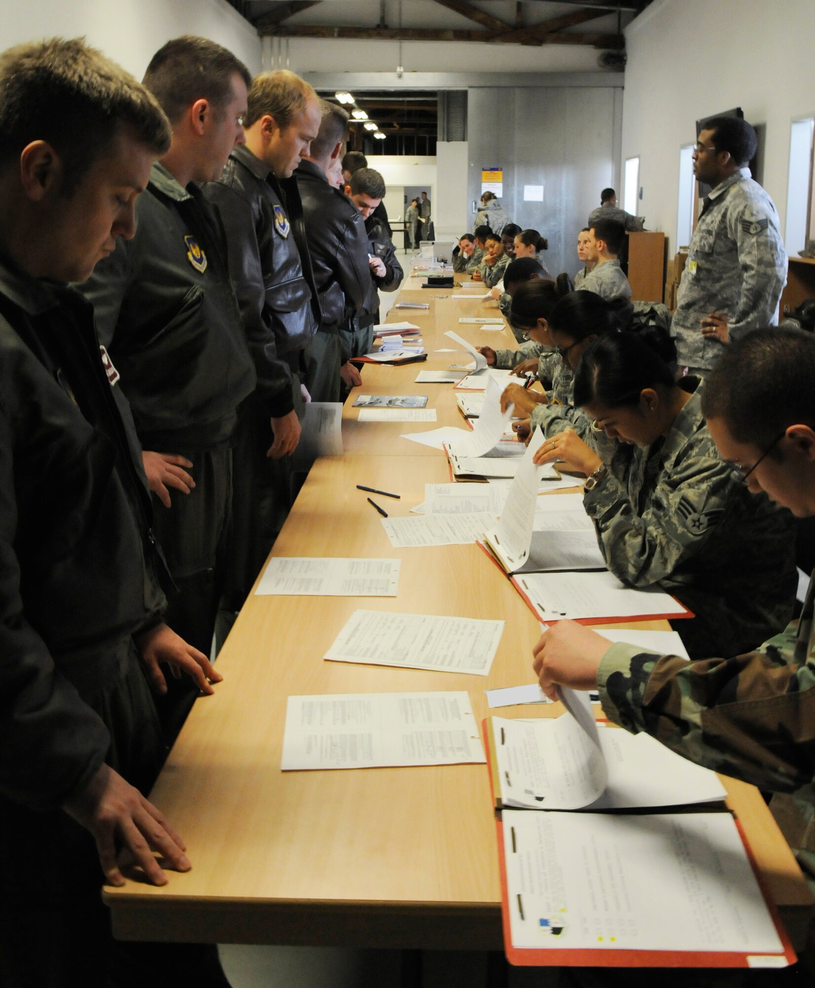 SPANGDAHLEM AIR BASE, Germany – Members from the 22nd Fighter Squadron process through a personnel deployment function line during Operation Saber Crown 10-03 Jan. 20 in Bldg. 103. The exercise evaluated the wing’s ability to support short-notice deployments and to prepare for the upcoming operational readiness inspections and NATO force evaluation this summer. (U.S. Air Force photo/Airman 1st Class Staci Miller)