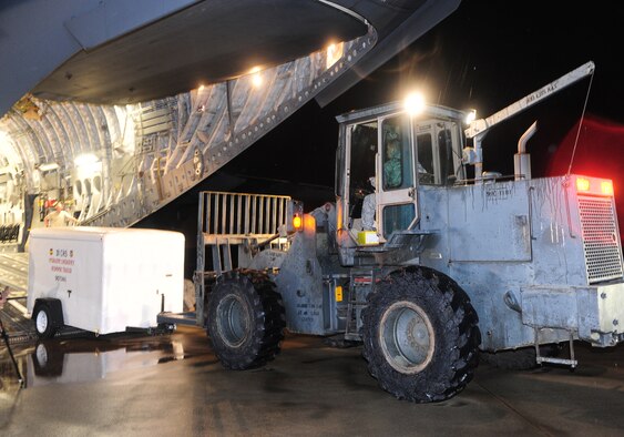 SHAW AIR FORCE BASE, S.C. -- Technical Sgt. Mark Anderson, 20th Logistics Readiness Squadron air transportation specialist, uses a forklift to load an emergency response trailer onto a C-17 Jan. 24. The equipment, which belongs to the 77th Fighter Squadron, is headed to Iraq in support of their ongoing deployment. (U.S. Air Force photo/2nd Lt. Tony Richardson)