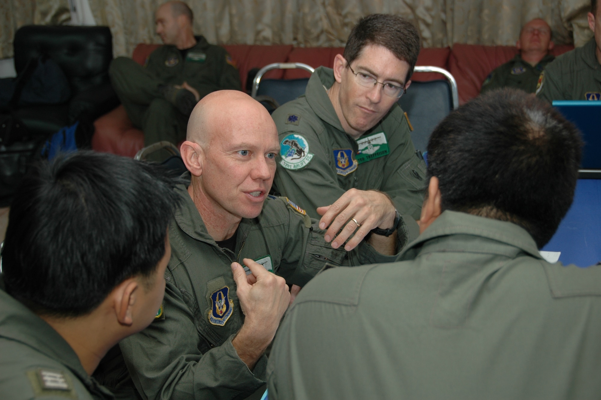 Lt. Col. James M. Steward, chief of flying safety for with the U.S. Air Force Reserve’s 302nd Airlift Wing based at Peterson AFB, Colo., discusses aerial firefighting techniques while Lt. Col. Ted F. Treffeisen, chief of training, 302 AW and members of the Royal Thai Air Force listen during a preflight briefing.  Seven members of the 302 AW traveled to Thailand to provide expert training to RTAF members on safe and effective Modular Airborne Firefighting System operations.  This event marks the first time the Air Force Reserve has sent delegates to train a foreign Air Force on use of the MAFFS equipment. (U.S. Air Force photo/Capt. Jody L. Ritchie)