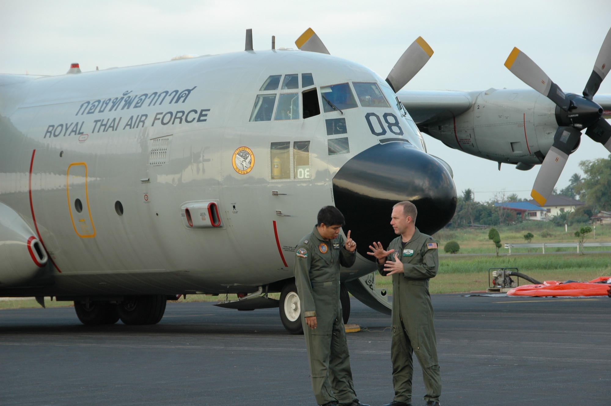 Lt. Col. James D. Banker, chief of current operations with the Air Force Reserve’s 302nd Airlift Wing based at Peterson AFB, Colo., discusses the challenges of flying the aerial firefighting mission with Squadron Leader Saraphongse Dibavadi, 601 squadron deputy commander, Royal Thai Air Force, prior to a training mission involving a wet drop at Phitsanulok RTAF Base, Thailand.  Seven members of the 302 AW traveled to Thailand to provide expert training to RTAF members on safe and effective Modular Airborne Firefighting System operations.  This event marks the first time the Air Force Reserve has sent delegates to train a foreign Air Force on use of the MAFFS equipment. (U.S. Air Force photo/Capt. Jody L. Ritchie)