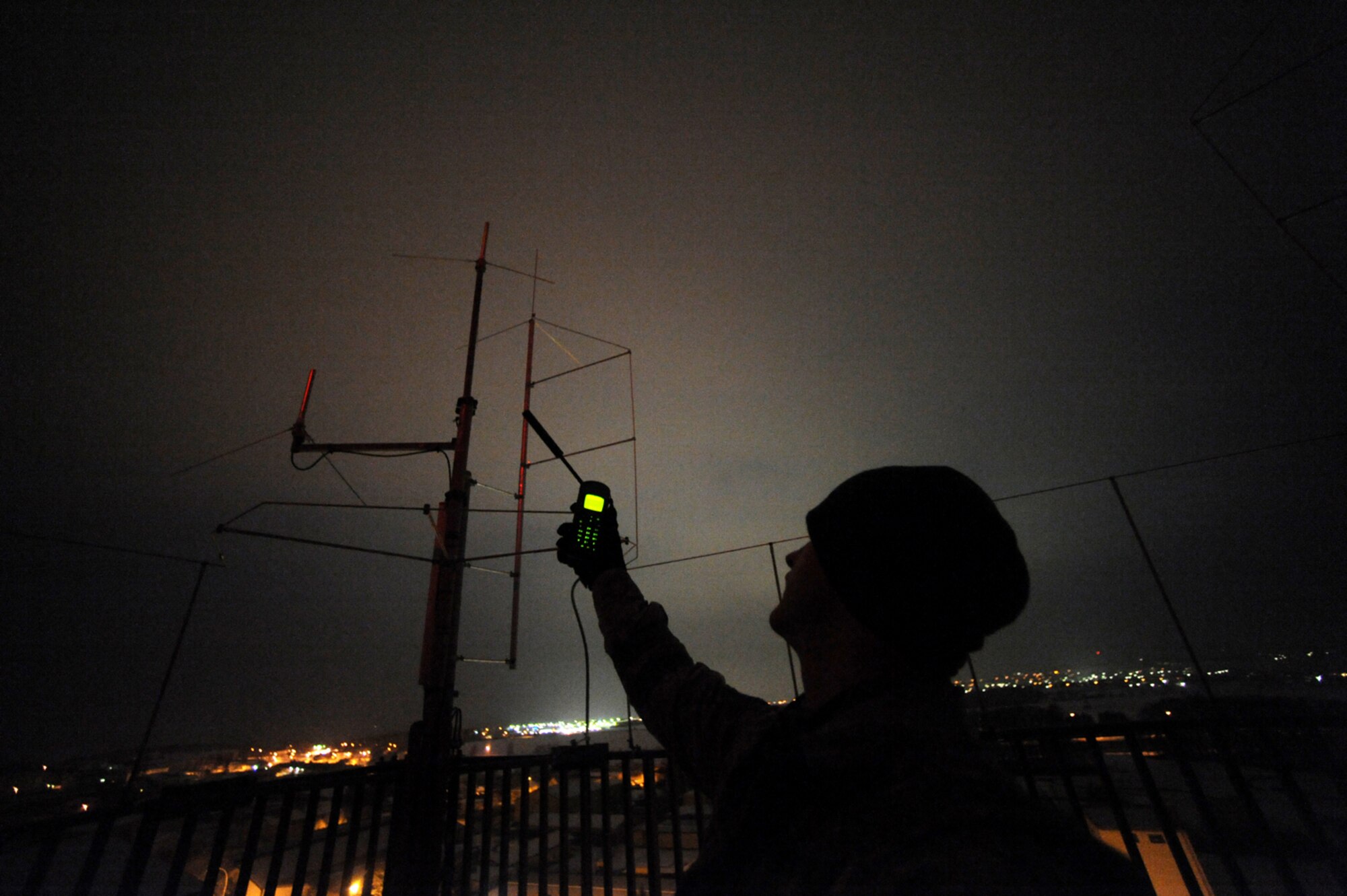 U.S. Air Force Staff Sgt. Ronald Booth, 435th Air Mobility Squadron, Ramstein Air Base, Germany, relays information about a secured airfield after an insertion mission, Flugplatz Bibturg, Germany, Jan. 25, 2010, in preparation of Ramstein's September operational readiness inspection. The unit is setting up bare-base operations as part of the dual-wing operational readiness exercise with the 86th Airlift Wing. This is the second of five operational readiness exercises. (U.S. Air Force photo by Staff Sgt. Sarayuth Pinthong)