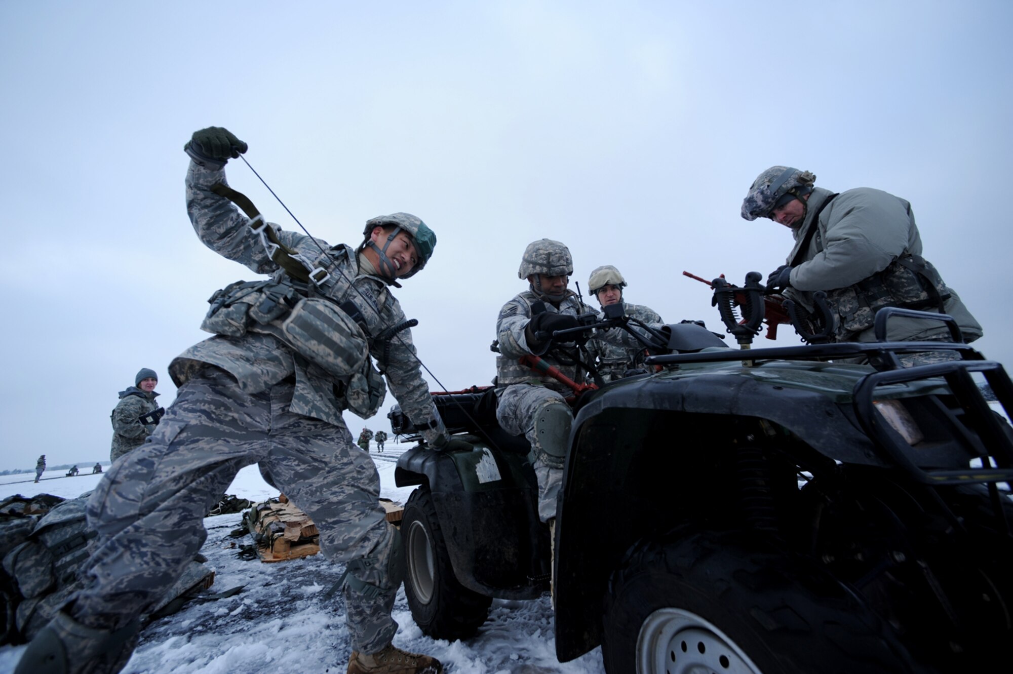 U.S. Air Force members from 435th Air Ground Operations Wing, Ramstein Air Base, Germany, attempt to start their four-wheeler after an airborne insertion mission, Flugplatz Bitburg, Germany, Jan. 25, 2010, in preparation of Ramstein's operational readiness inspection in September. The unit is setting up bare-base operations as part of the dual-wing operational readiness exercise with the 86th Airlift Wing. This is the second of five operational readiness exercises. (U.S. Air Force photo by Staff Sgt. Sarayuth Pinthong)