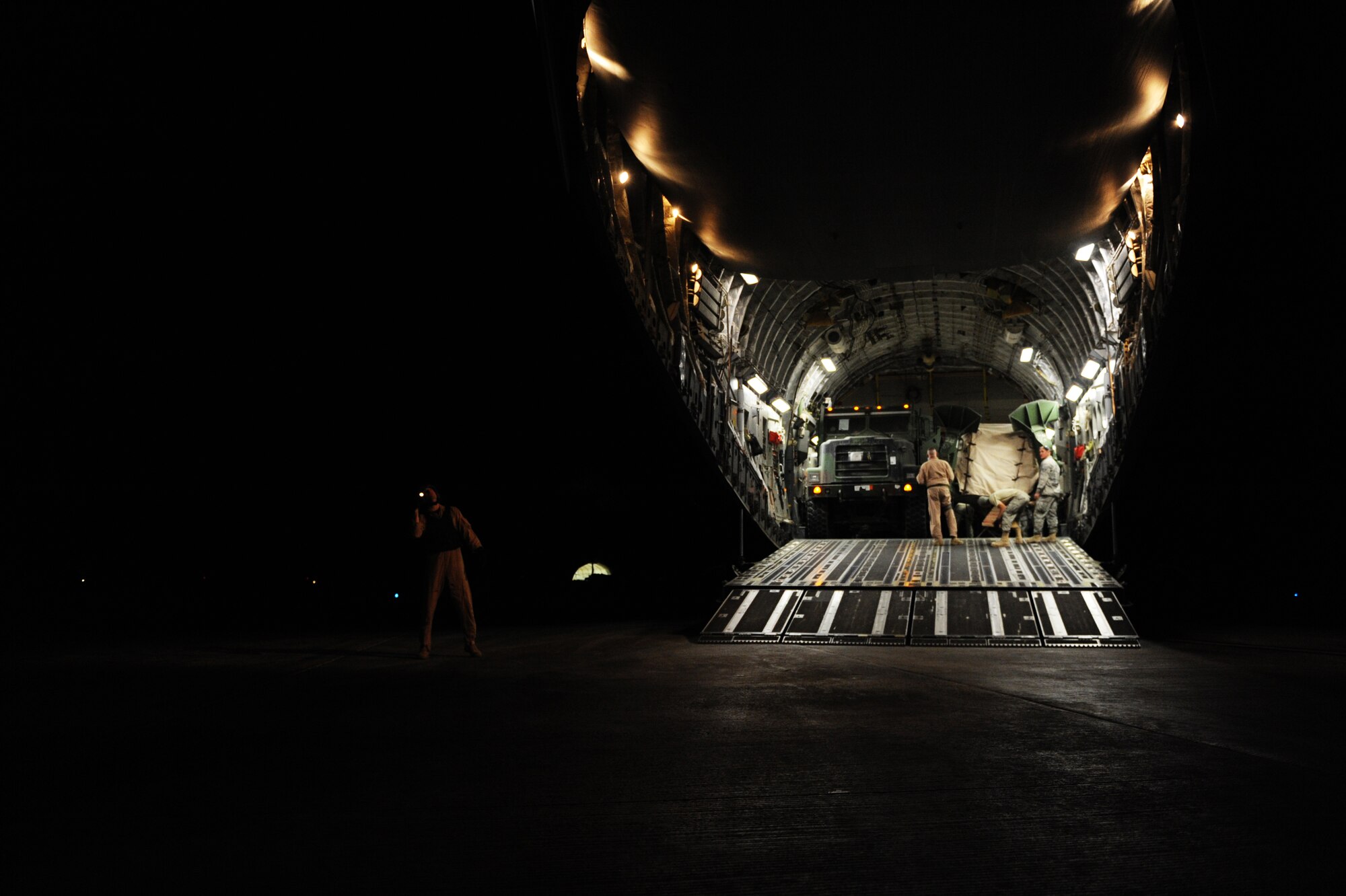 A C-17A Globemaster III aircrew unloads 95,000 pounds of cargo at Camp Bastion, Afghanistan, Jan. 20, 2010. The aircrew is assigned to the 816th Expeditionary Airlift Squadron. (U.S. Air Force photo/Staff Sgt. Manuel J. Martinez)