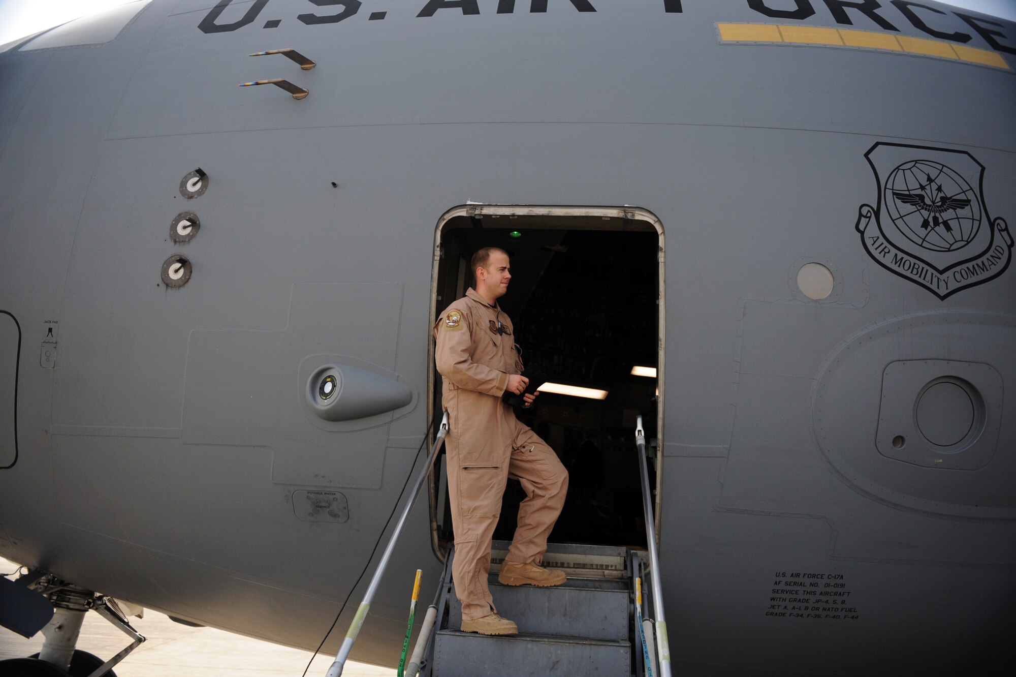 Senior Airman Anthony E. Fuller, a loadmaster from the 816th Expeditionary Airlift Squadron, waits to perform pre-flight checks aboard a C-17A Globemaster III Jan. 20, 2010, at a forward operating base in Southwest Asia. (U.S. Air Force photo/Staff Sgt. Manuel J. Martinez)