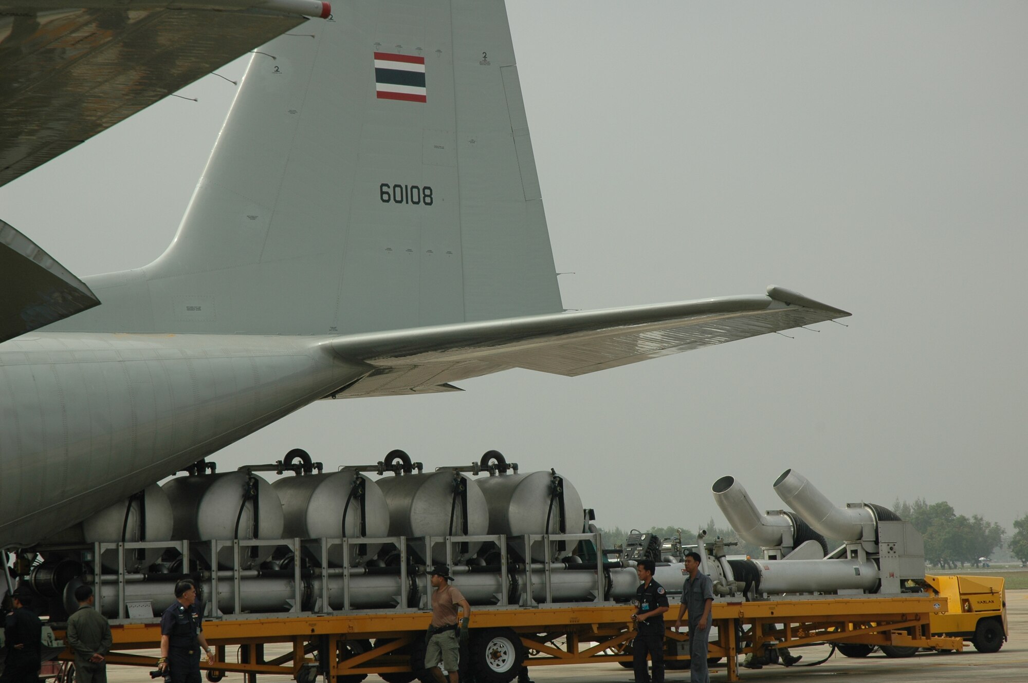 A Modular Airborne Firefighting System is loaded onto a Royal Thai Air Force C-130 with help from U.S. Air Force Reserve Airmen at Don Muang Royal Thai Air Force Base, Thailand.  The MAFFS system was transported from Don Muang RTAFB to Phitsanulok RTAFB for MAFFS flying training.  Seven members of the Air Force Reserve’s 302nd Airlift Wing traveled to Thailand to provide expert training to RTAF members on safe and effective Modular Airborne Firefighting System operations.  This event marks the first time the Air Force Reserve has sent delegates to train a foreign Air Force on use of the MAFFS equipment. (U.S. Air Force photo/Capt. Jody L. Ritchie)